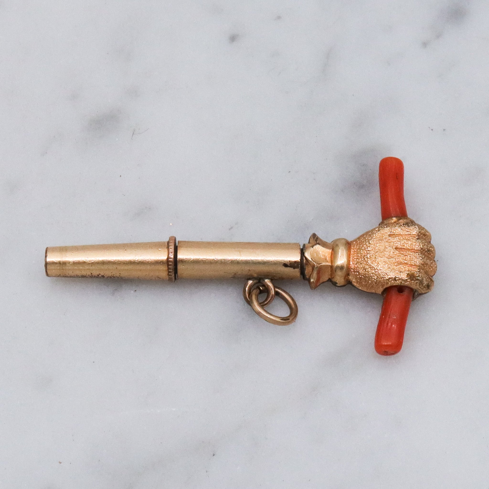 Antique Victorian gold filled raised fist with coral watch key fob