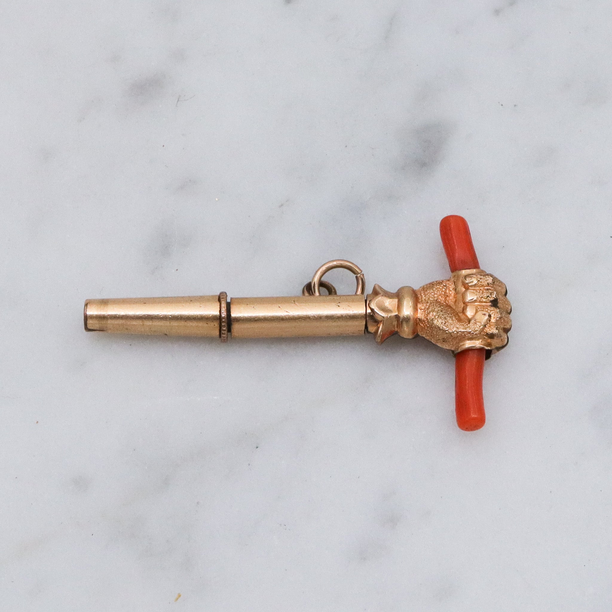 Antique Victorian gold filled raised fist with coral watch key fob
