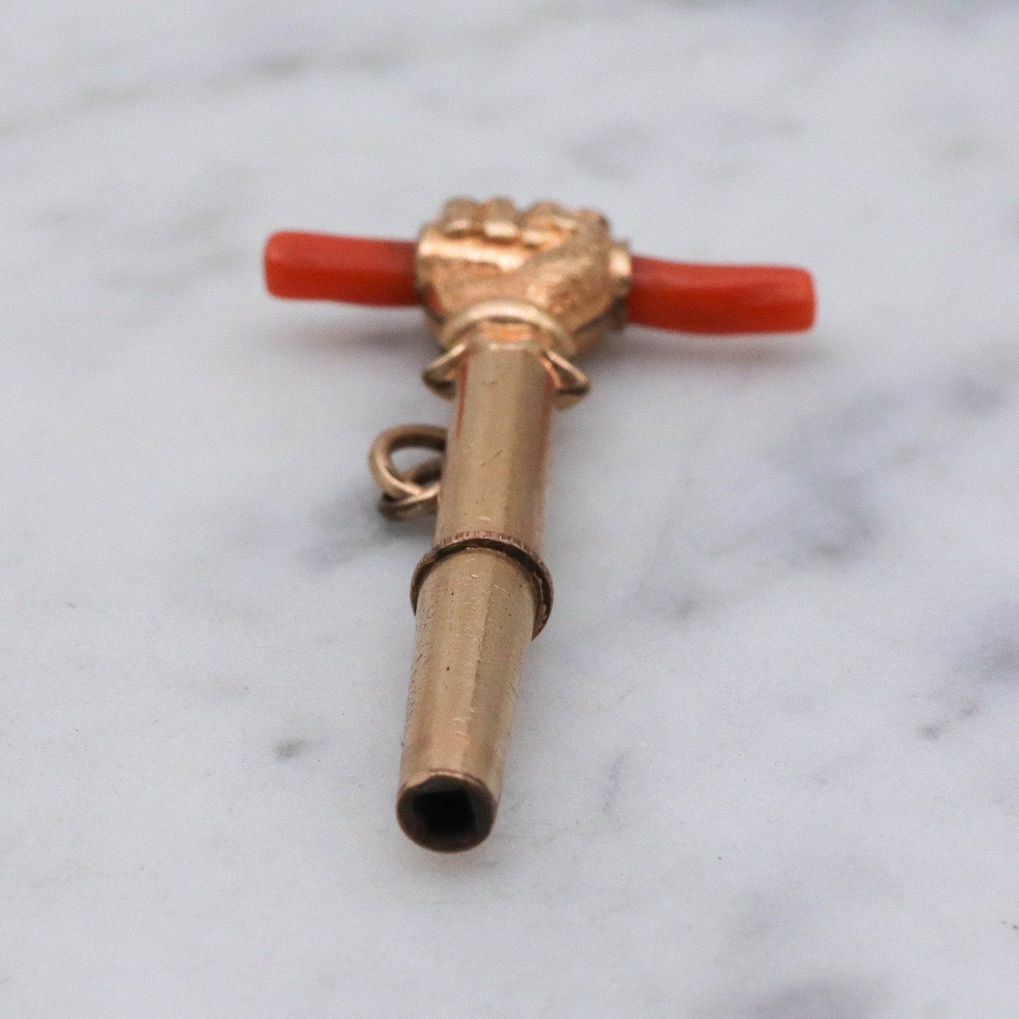 Antique Victorian gold filled raised fist with coral watch key fob