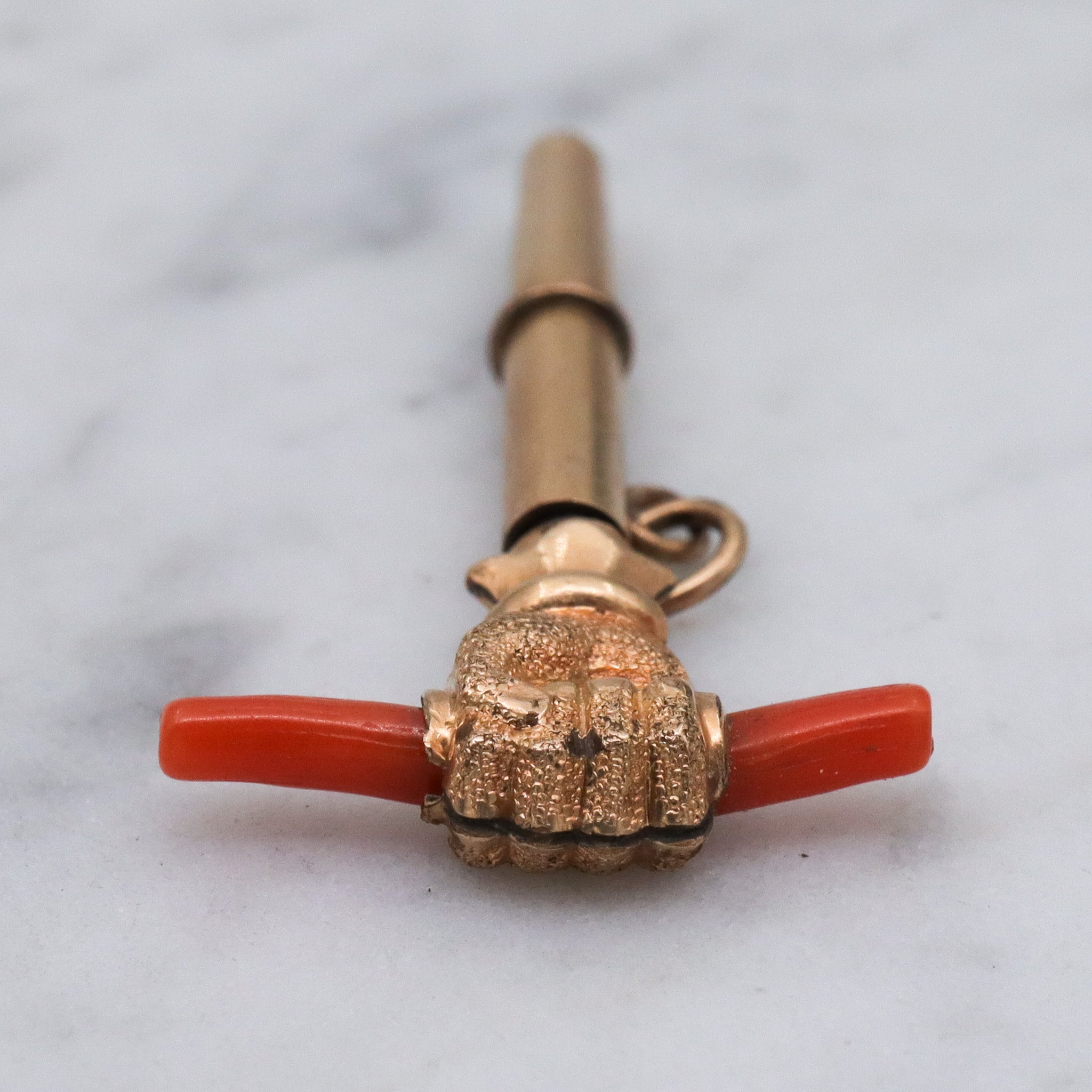 Antique Victorian gold filled raised fist with coral watch key fob