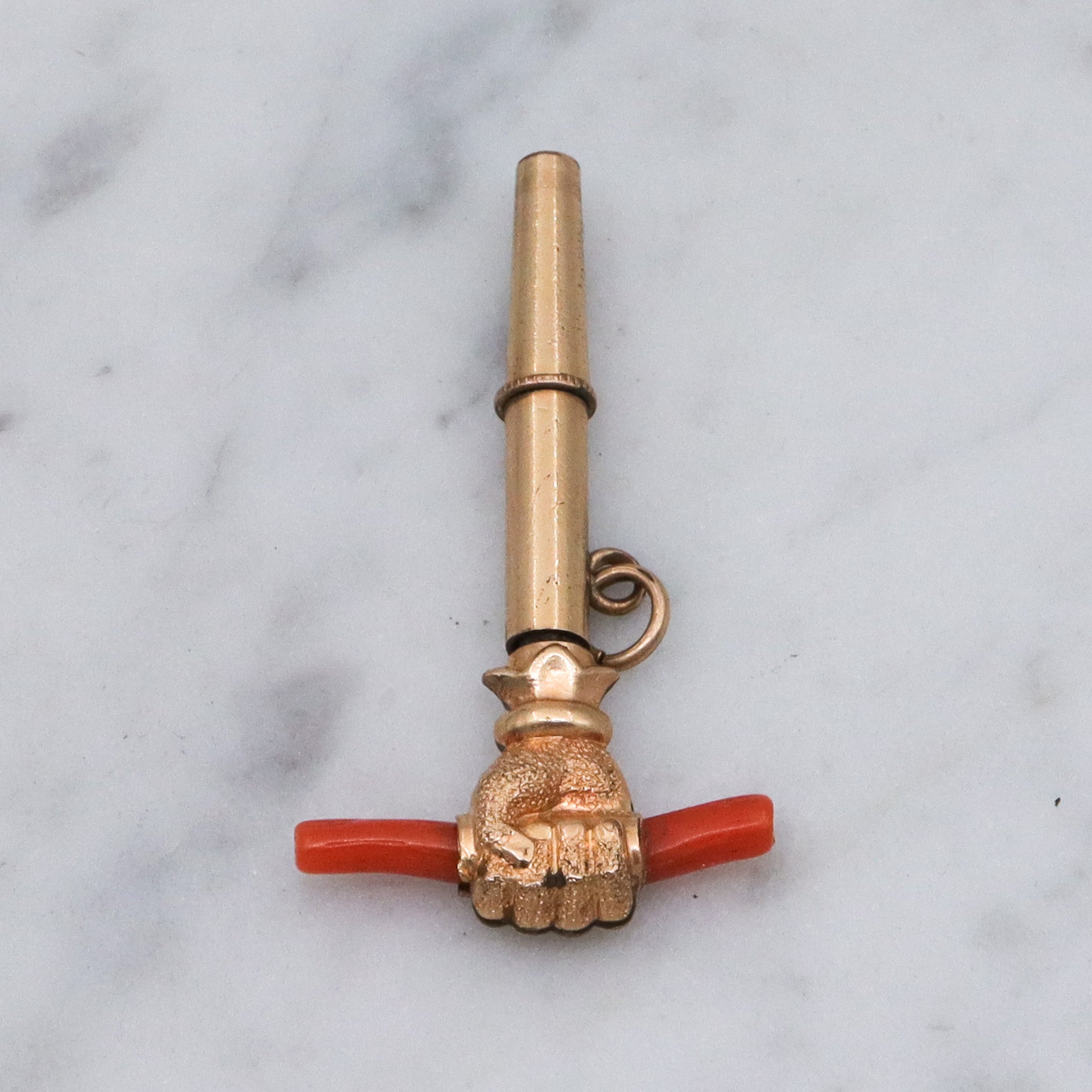 Antique Victorian gold filled raised fist with coral watch key fob