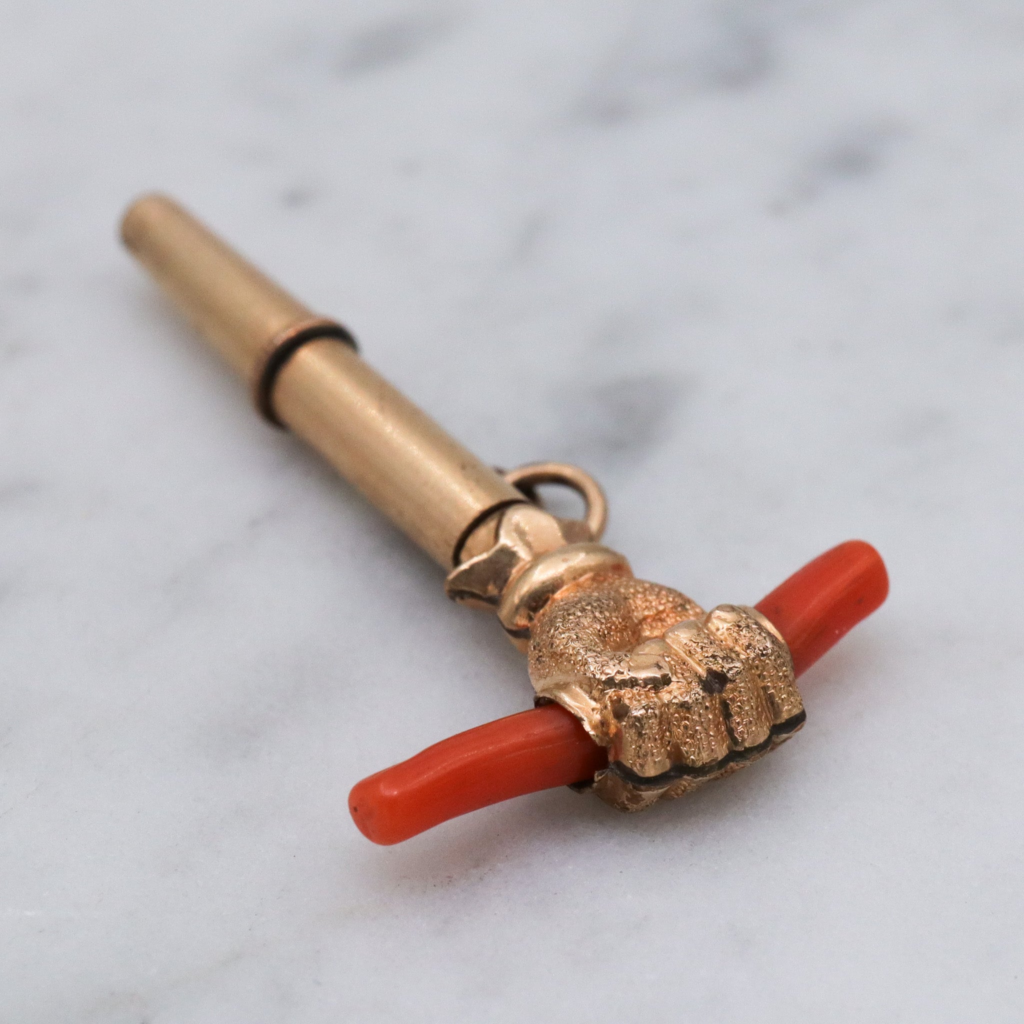 Antique Victorian gold filled raised fist with coral watch key fob
