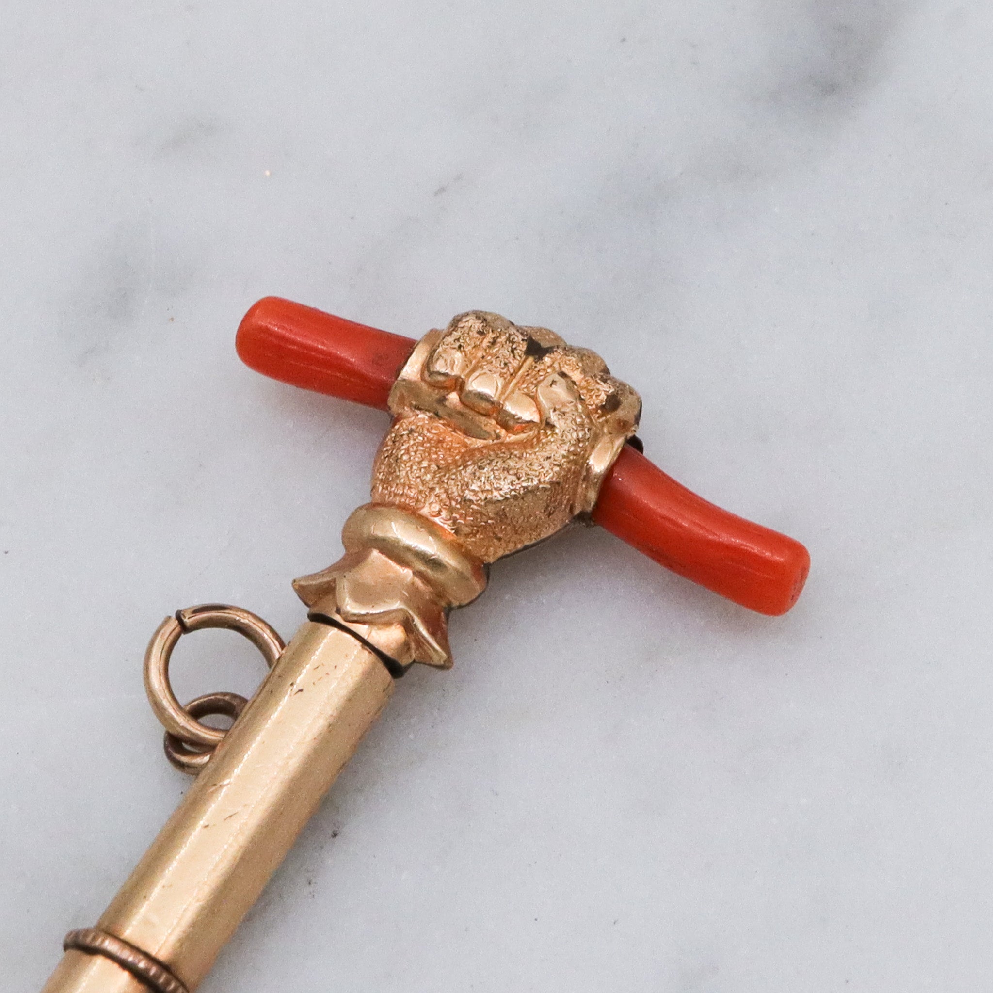 Antique Victorian gold filled raised fist with coral watch key fob
