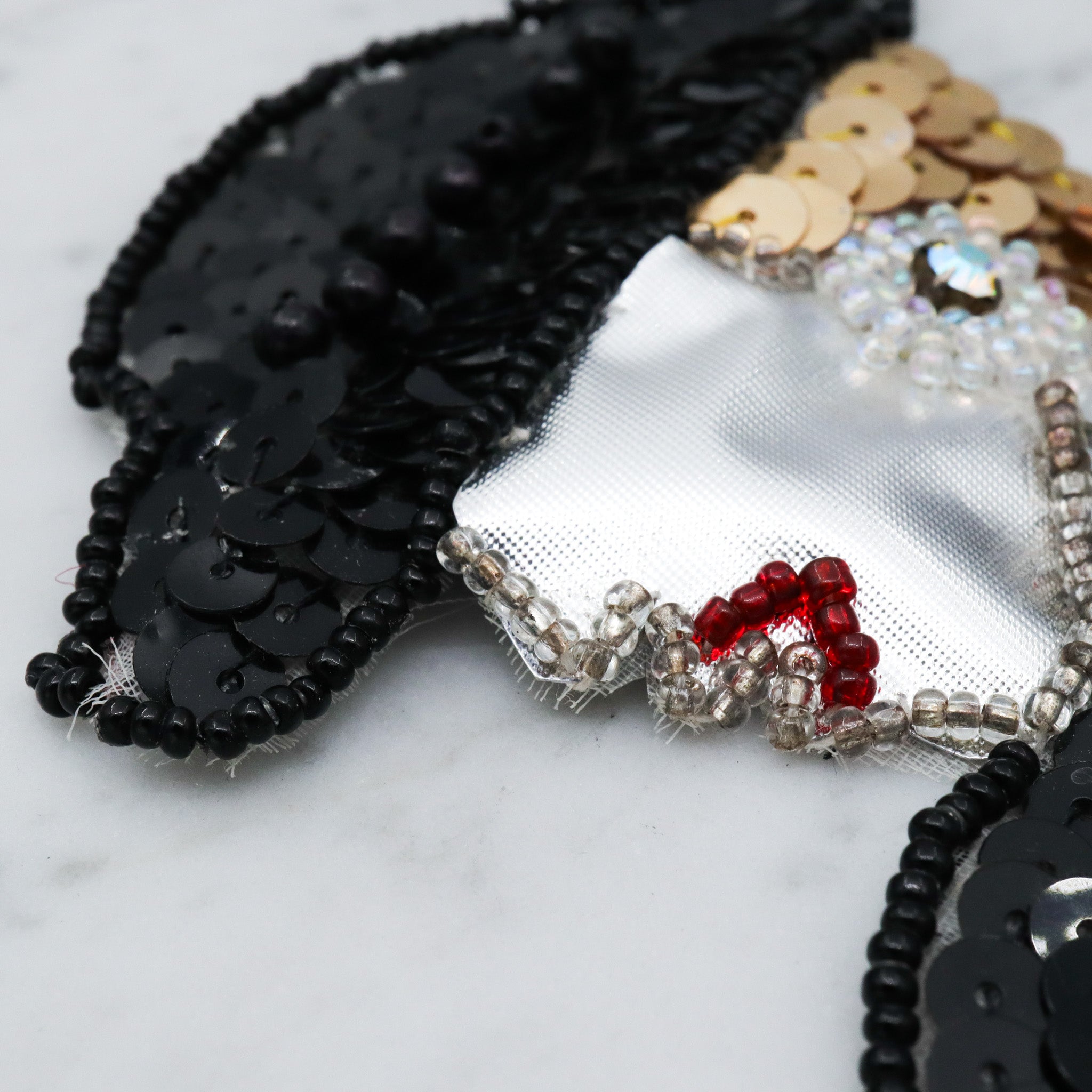 1980's handmade sequin applique brooch of a woman in a black hat