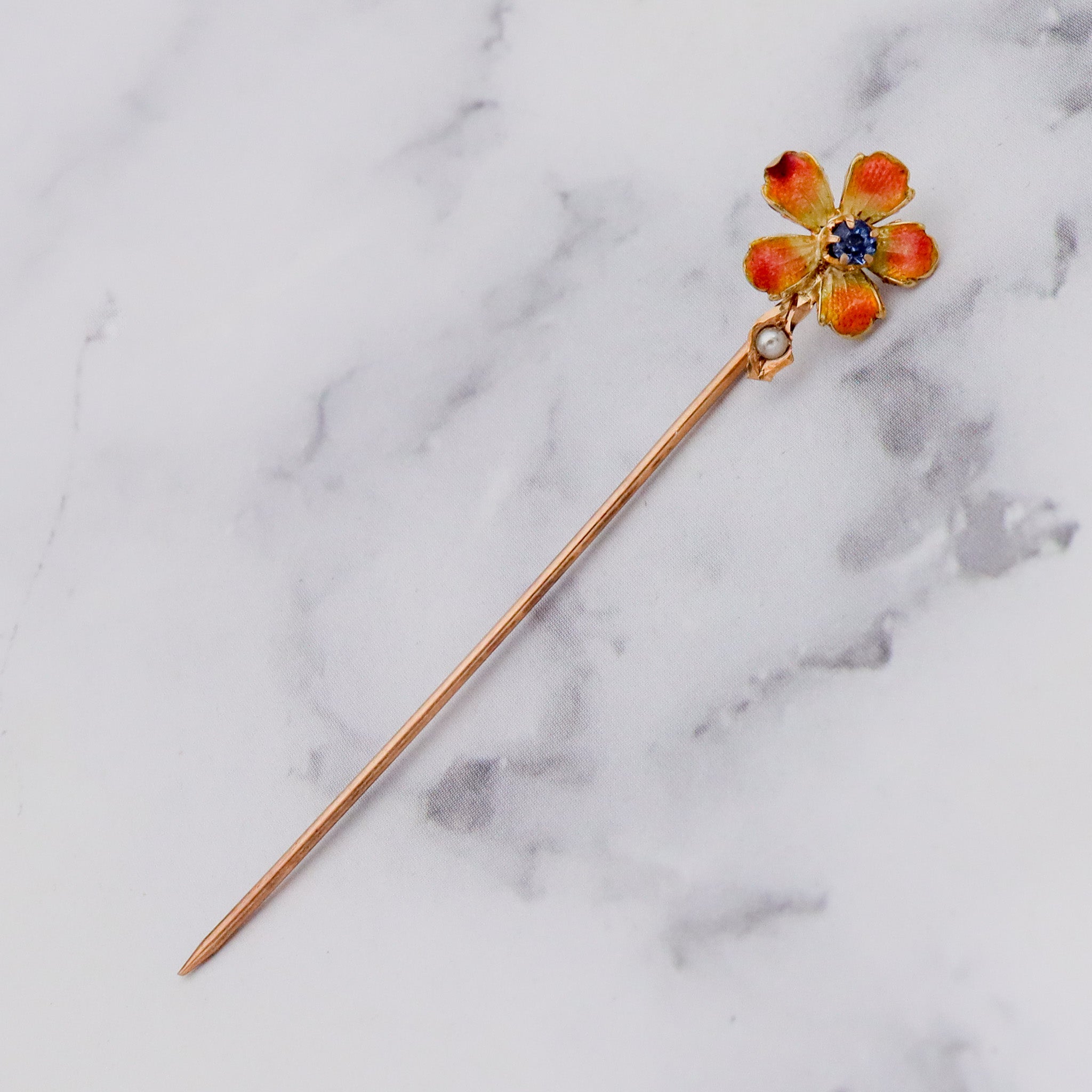 Antique Nouveau 10k gold, enamel, split pearl & faux sapphire stick pin
