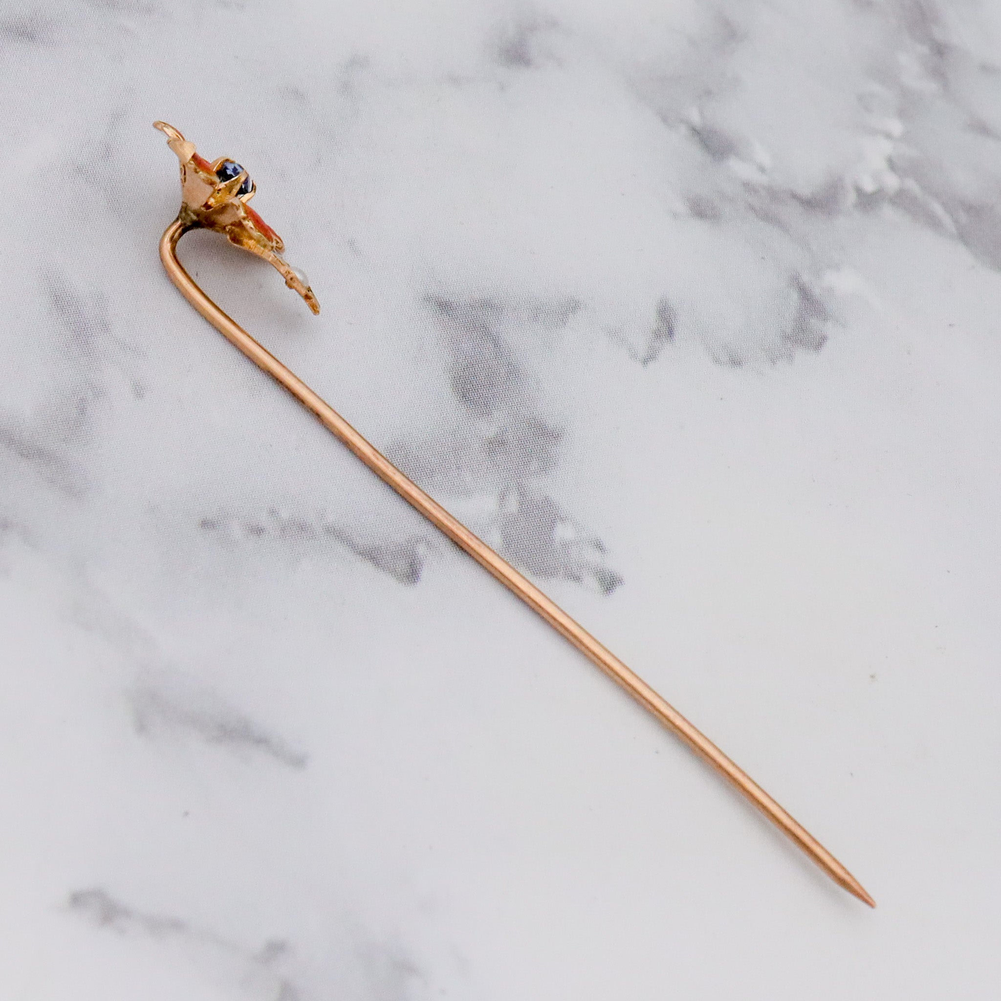 Antique Nouveau 10k gold, enamel, split pearl & faux sapphire stick pin