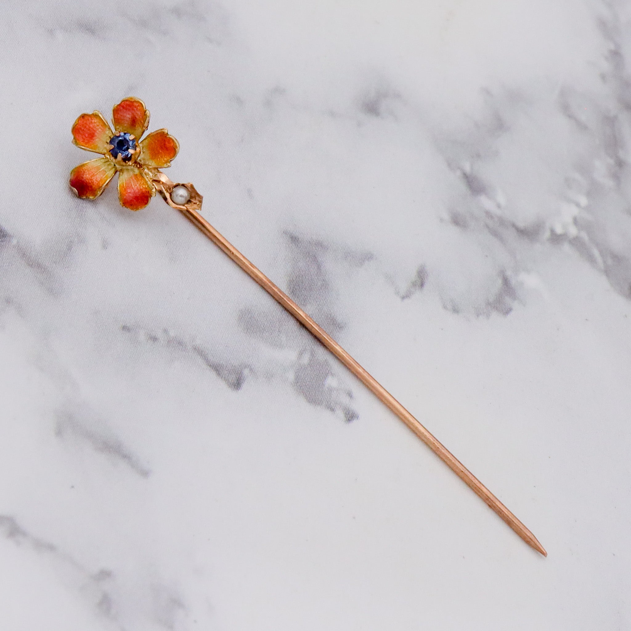 Antique Nouveau 10k gold, enamel, split pearl & faux sapphire stick pin