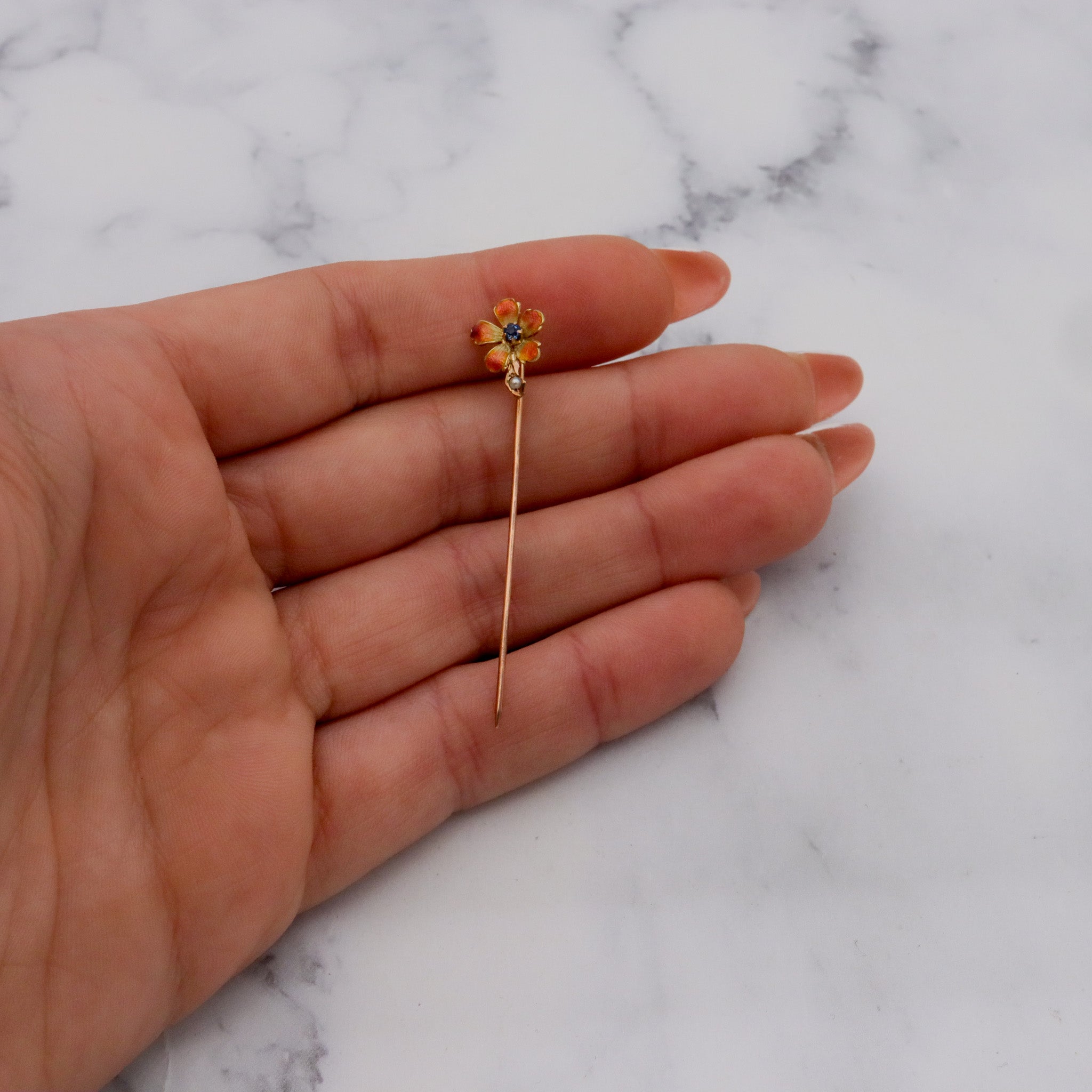 Antique Nouveau 10k gold, enamel, split pearl & faux sapphire stick pin