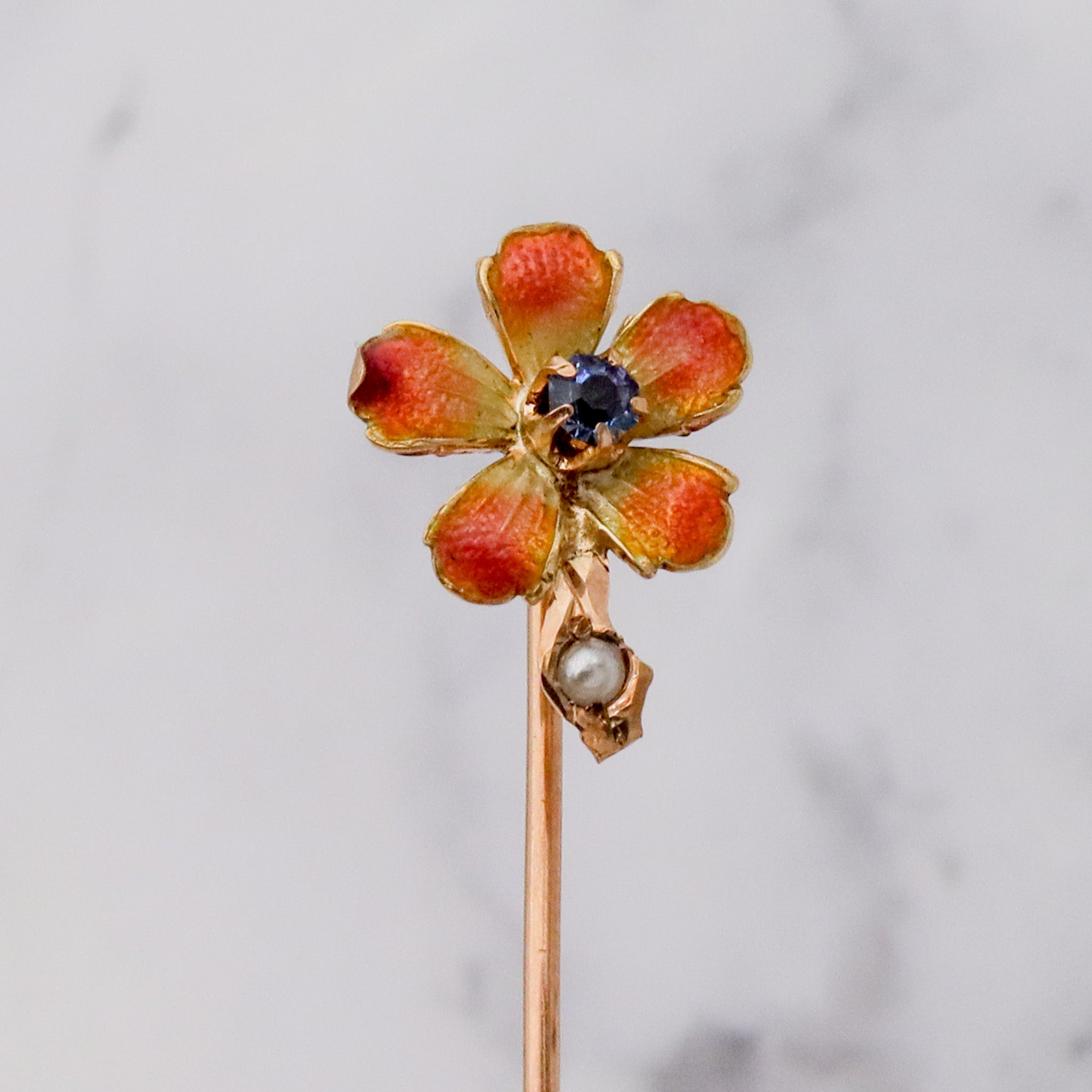 Antique Nouveau 10k gold, enamel, split pearl & faux sapphire stick pin