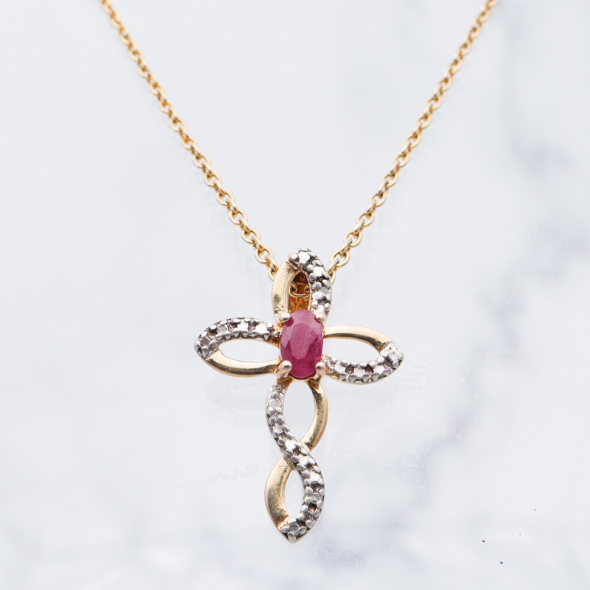 Vintage two toned sterling silver ruby & diamond cross pendant