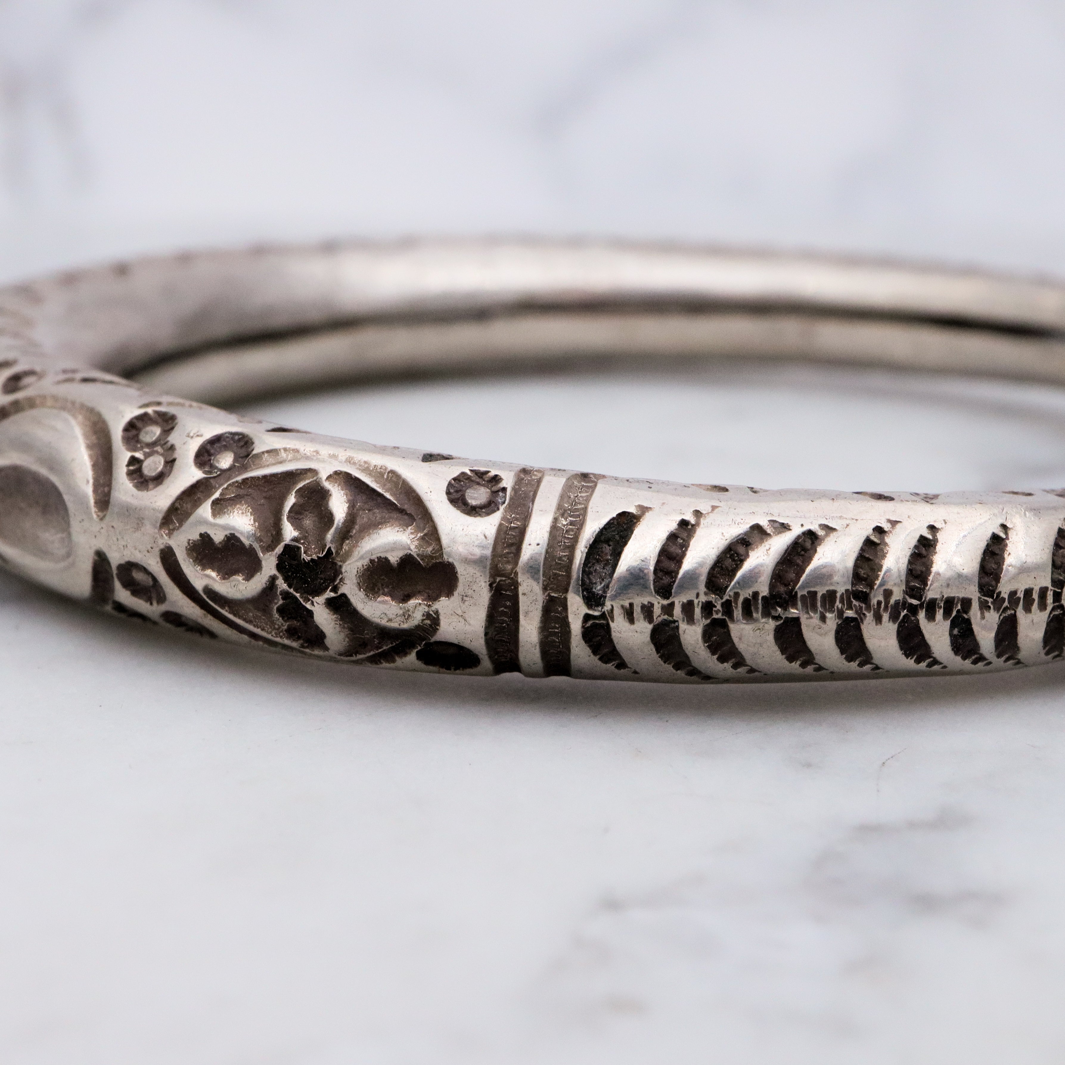 Vintage tribal stamped sterling hollow elephant head bangle