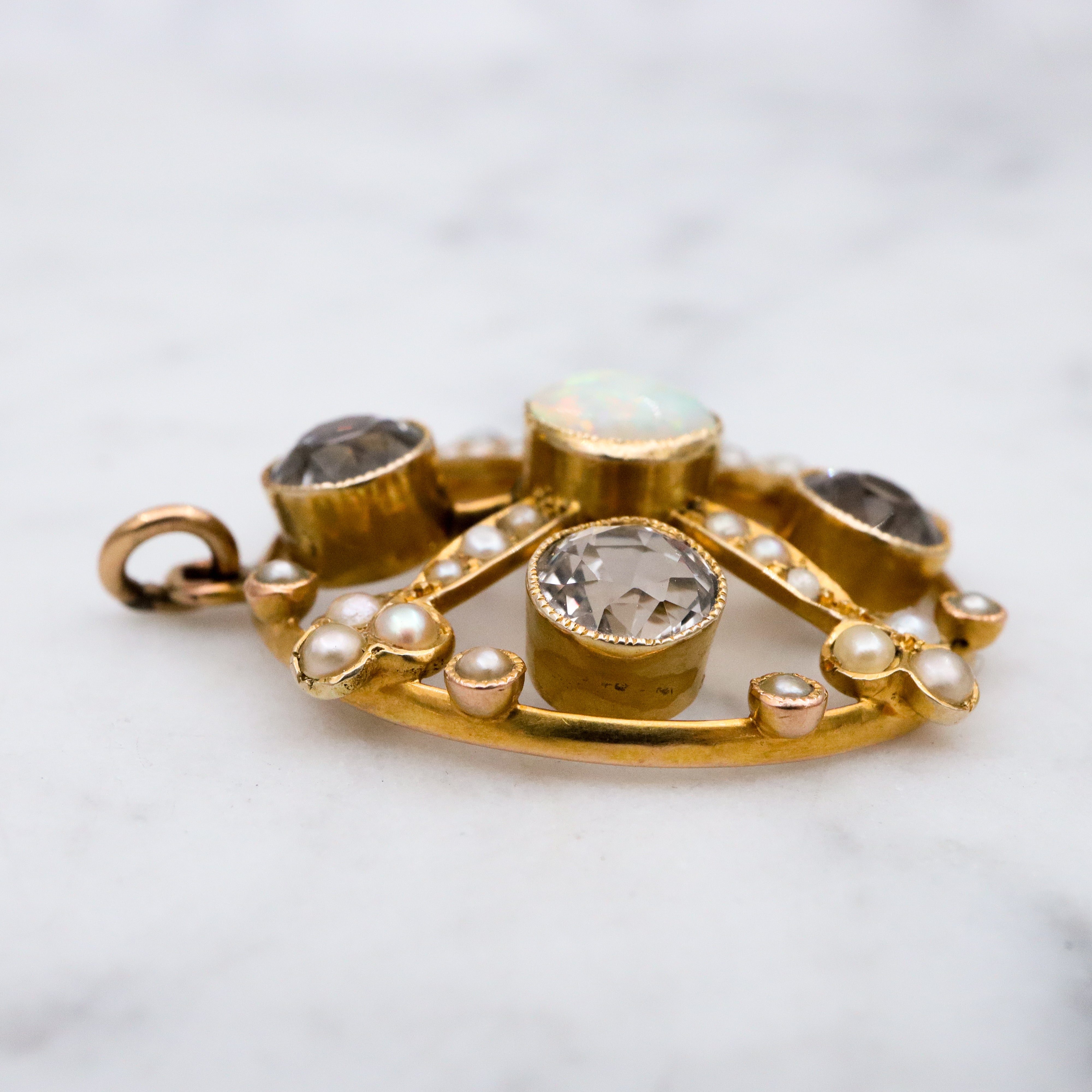 Antique Belle Epoque opal, white topaz, & pearl 9k gold circle pendant