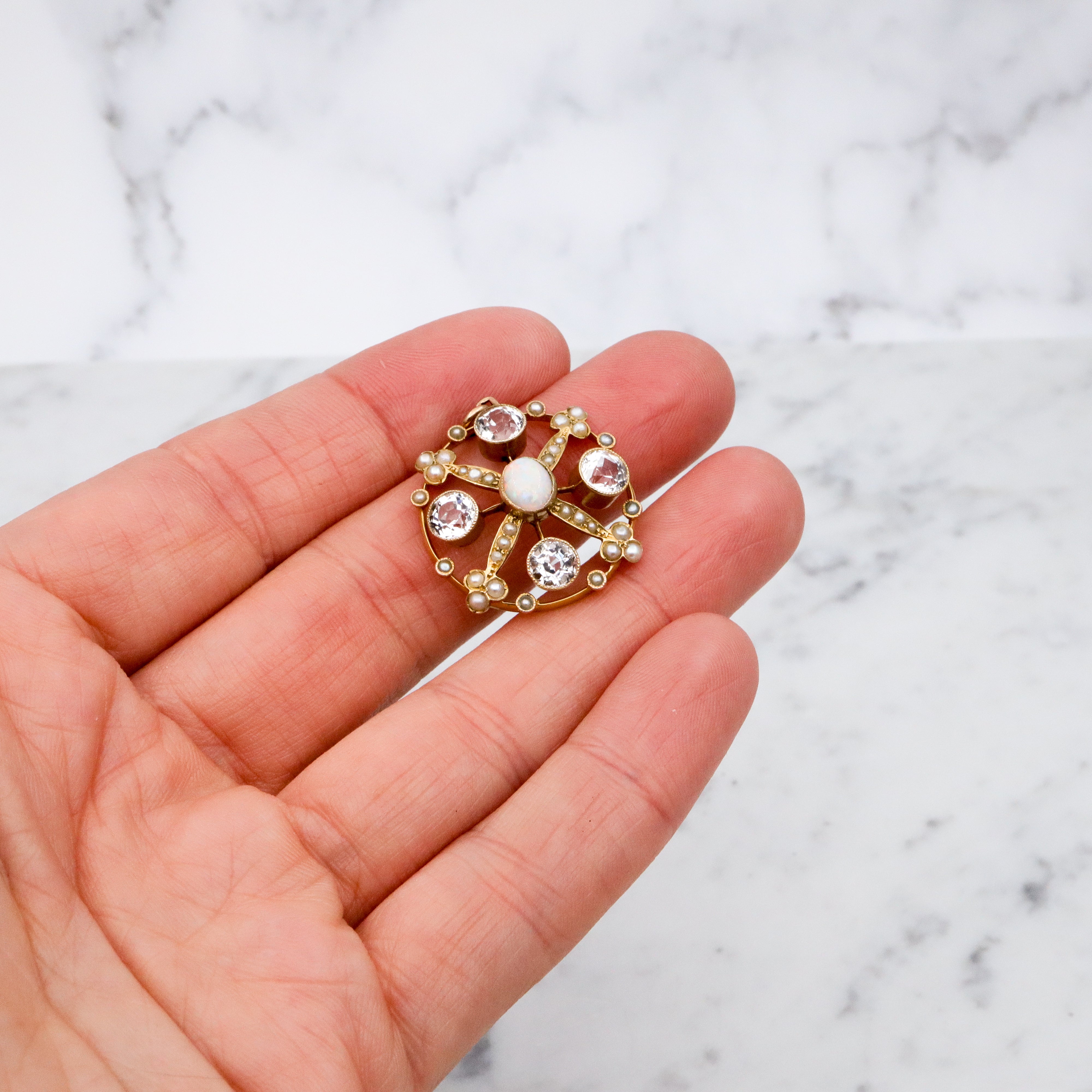 Antique Belle Epoque opal, white topaz, & pearl 9k gold circle pendant