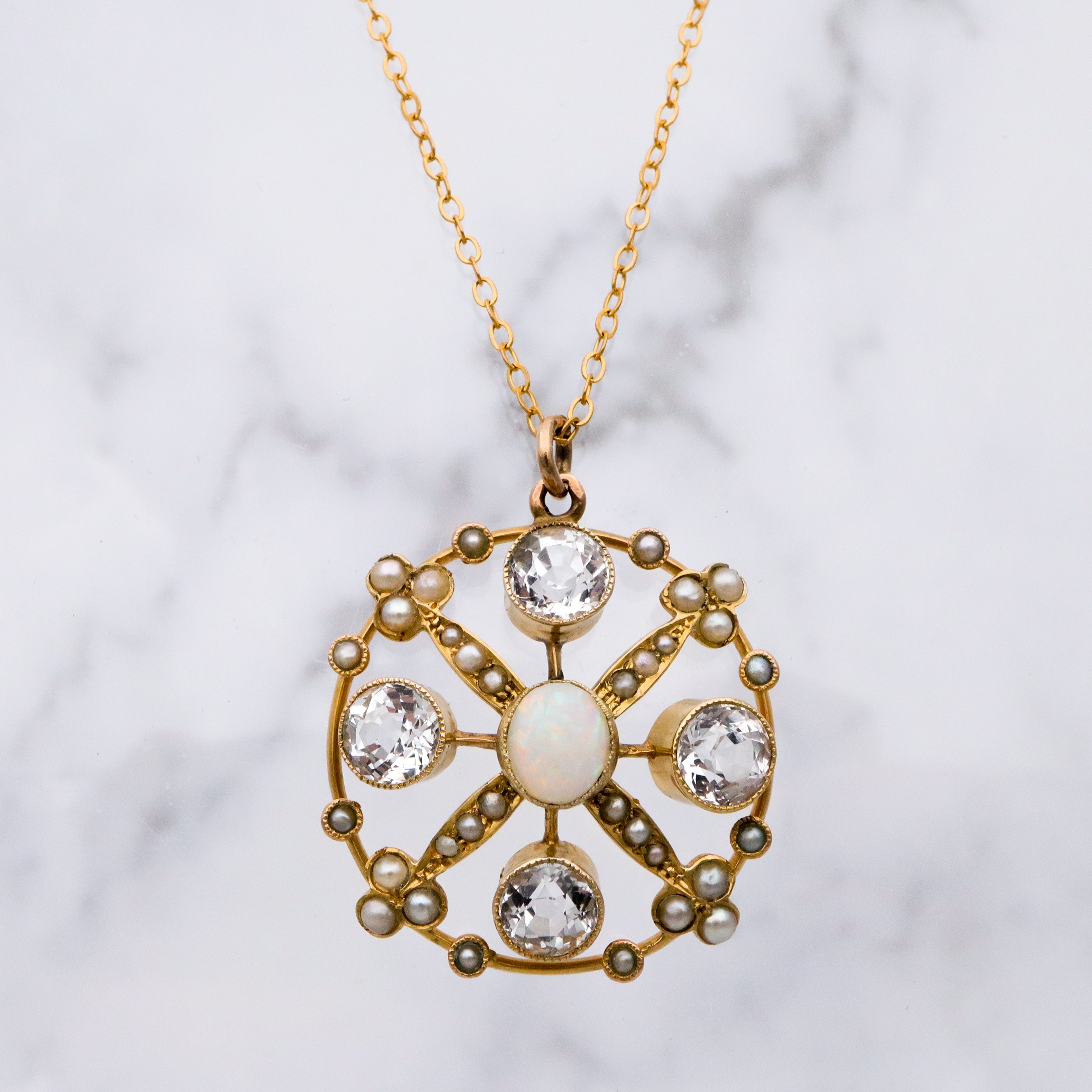 Antique Belle Epoque opal, white topaz, & pearl 9k gold circle pendant