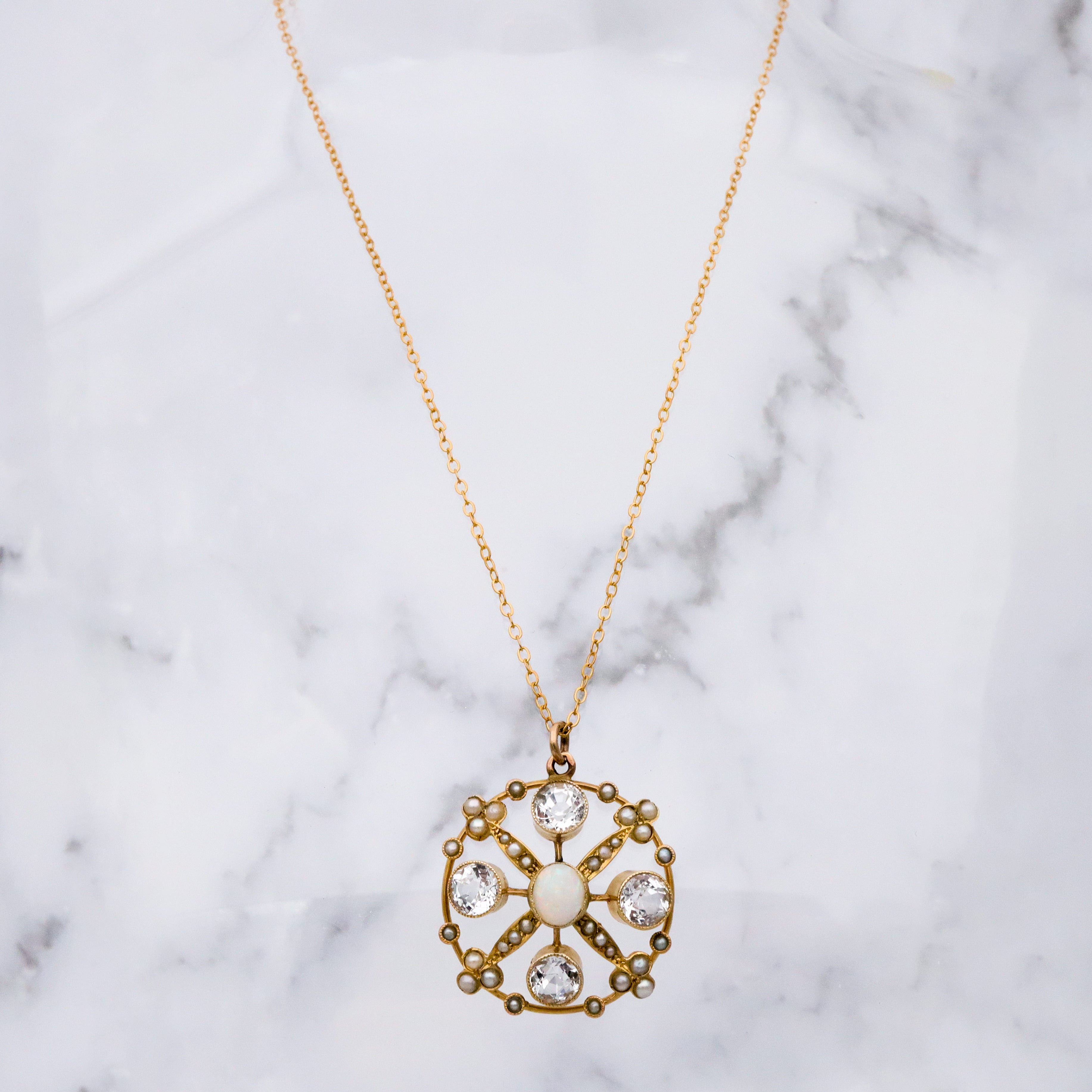 Antique Belle Epoque opal, white topaz, & pearl 9k gold circle pendant