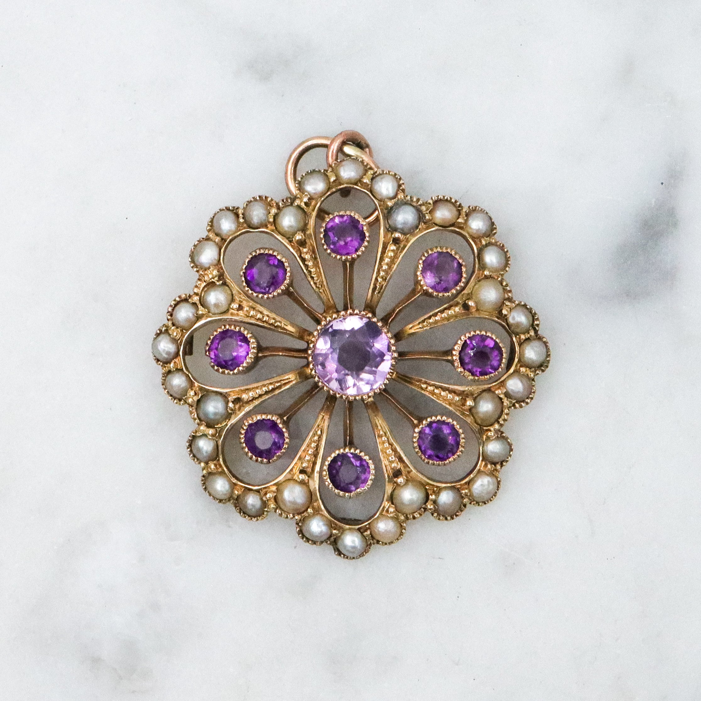 Antique early Victorian 9k gold, amethyst and split pearl flower pendant