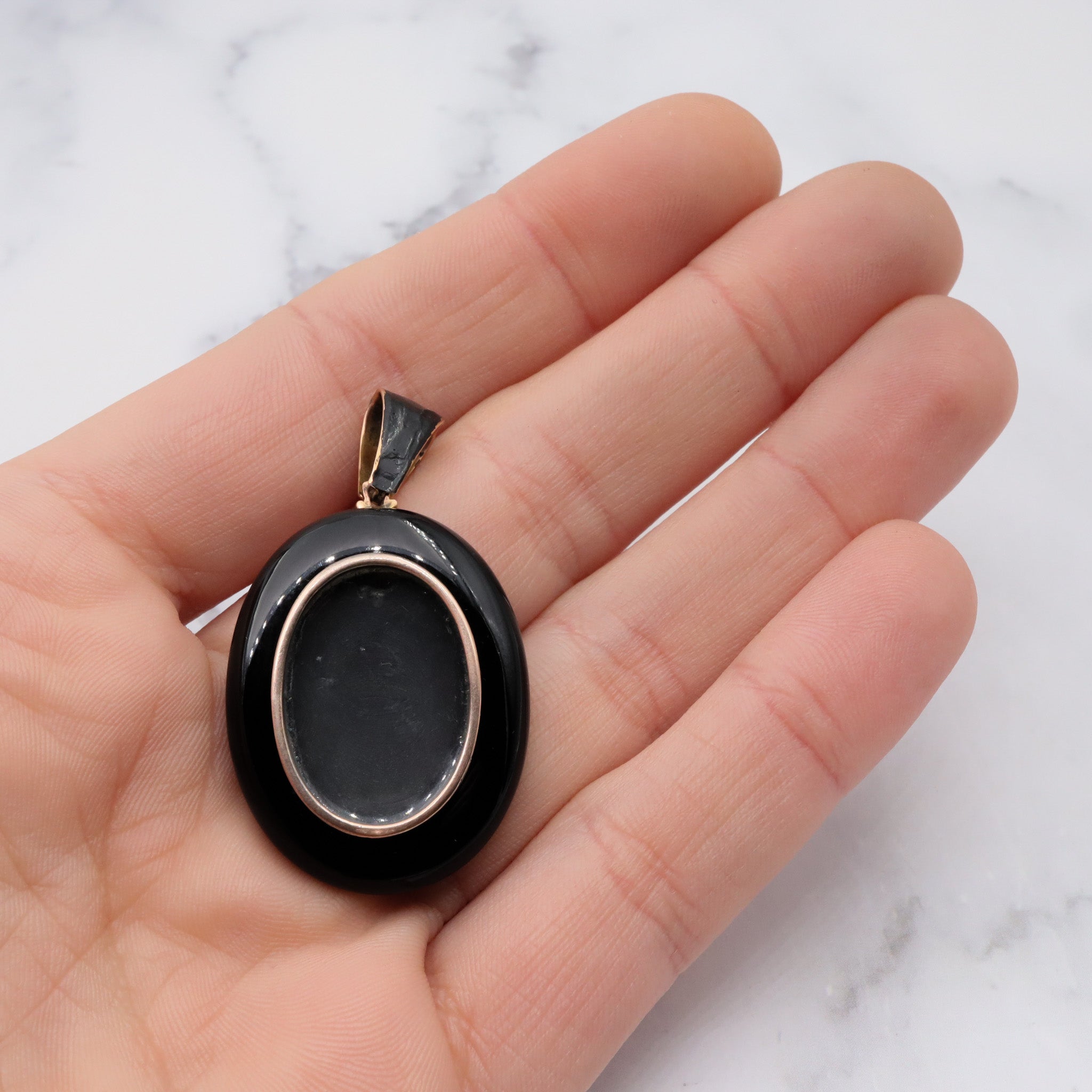 Antique victorian 18K gold and onyx mourning locket