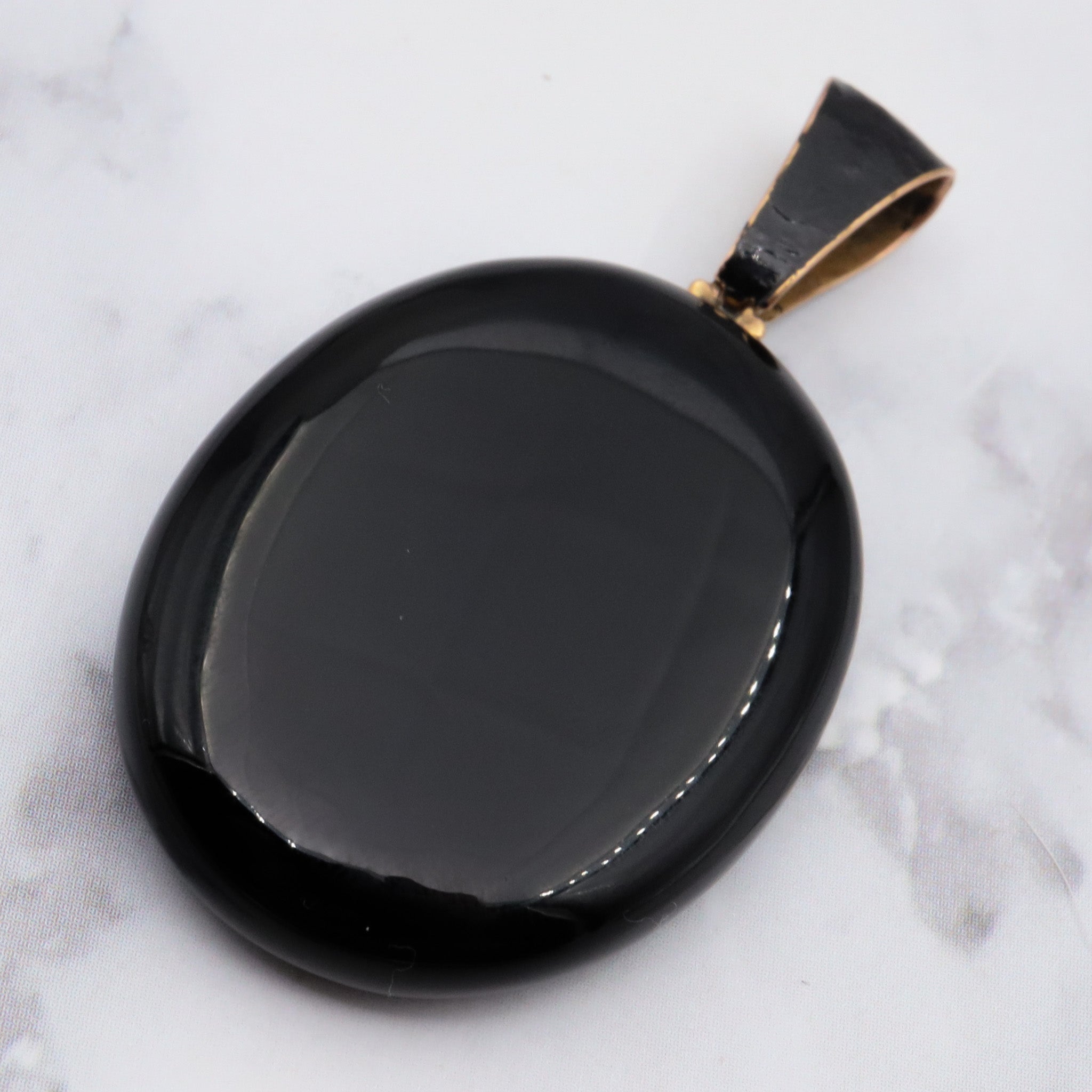 Antique victorian 18K gold and onyx mourning locket