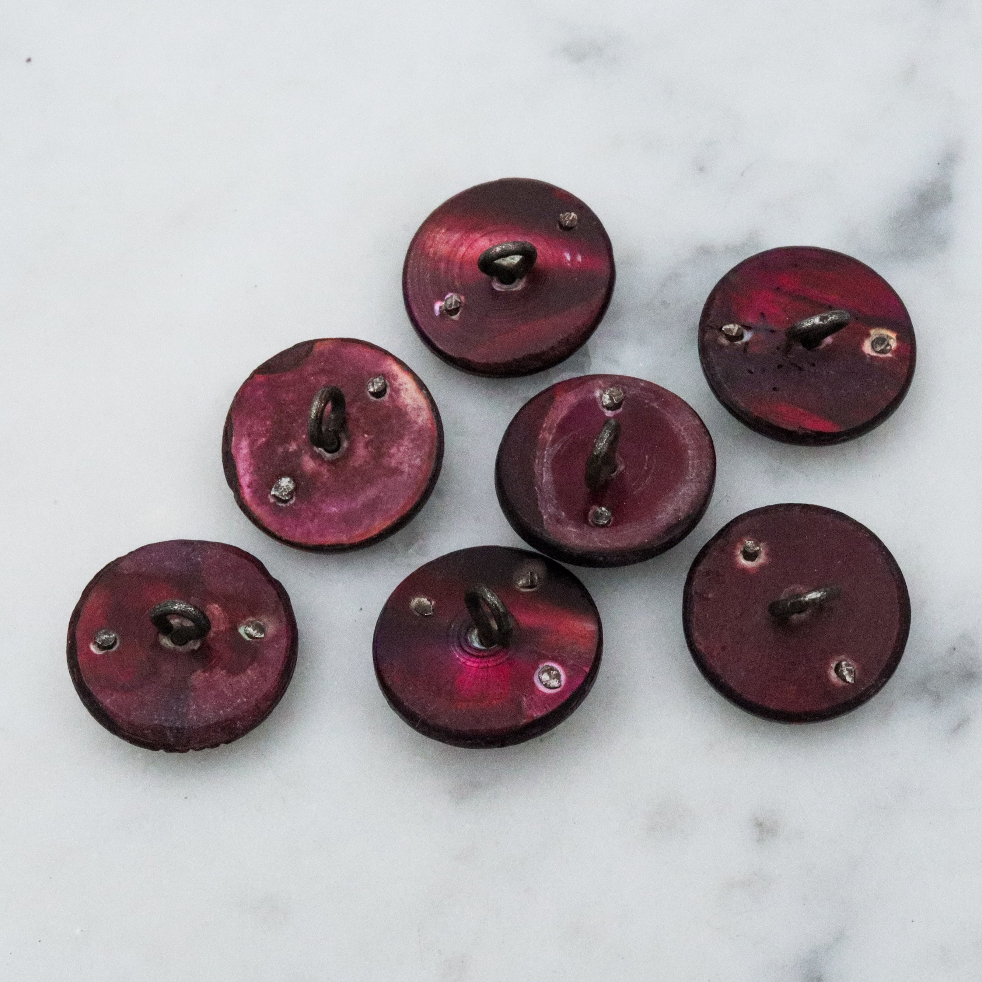 Set of 7 Antique Victorian purple shell cut steel rivet buttons