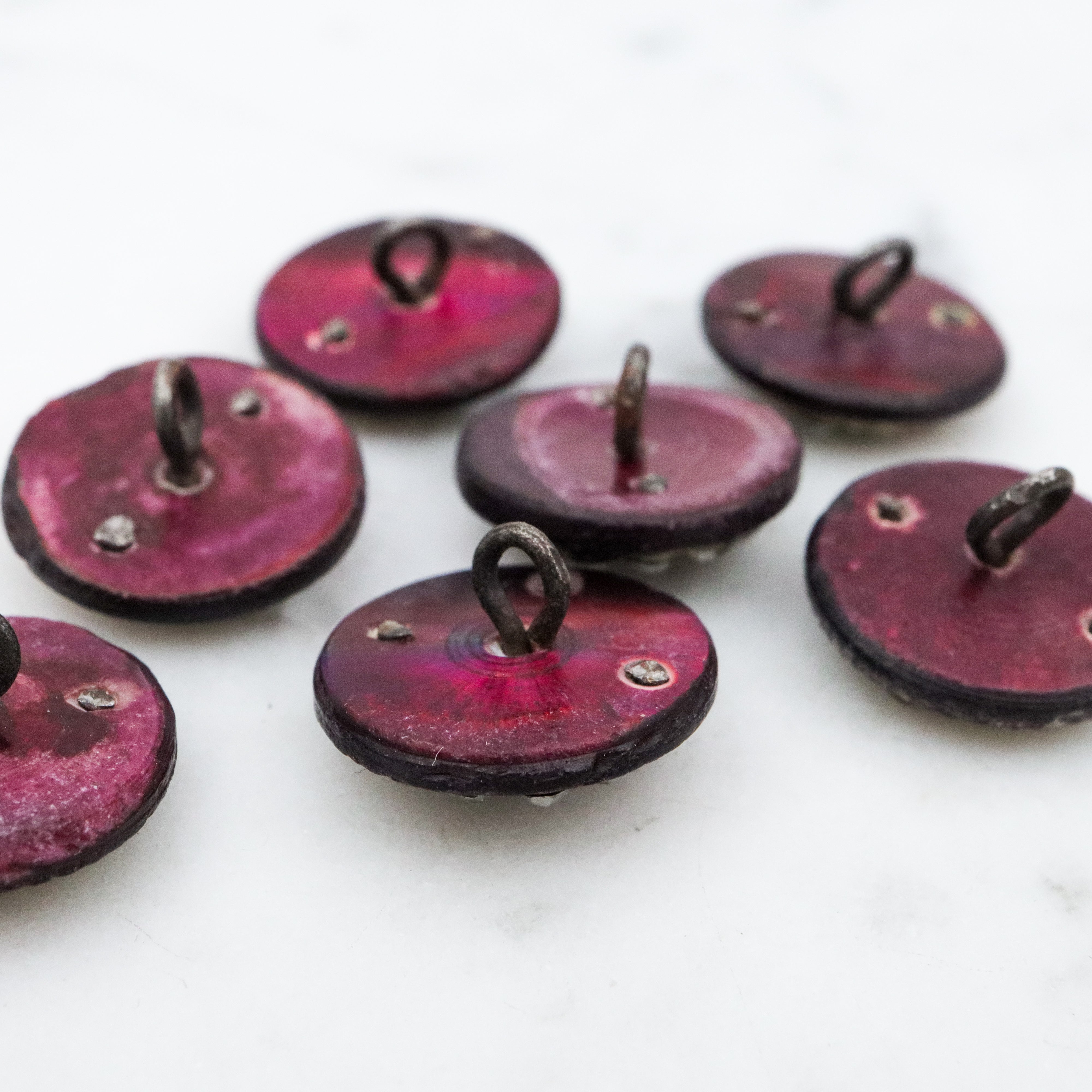 Set of 7 Antique Victorian purple shell cut steel rivet buttons