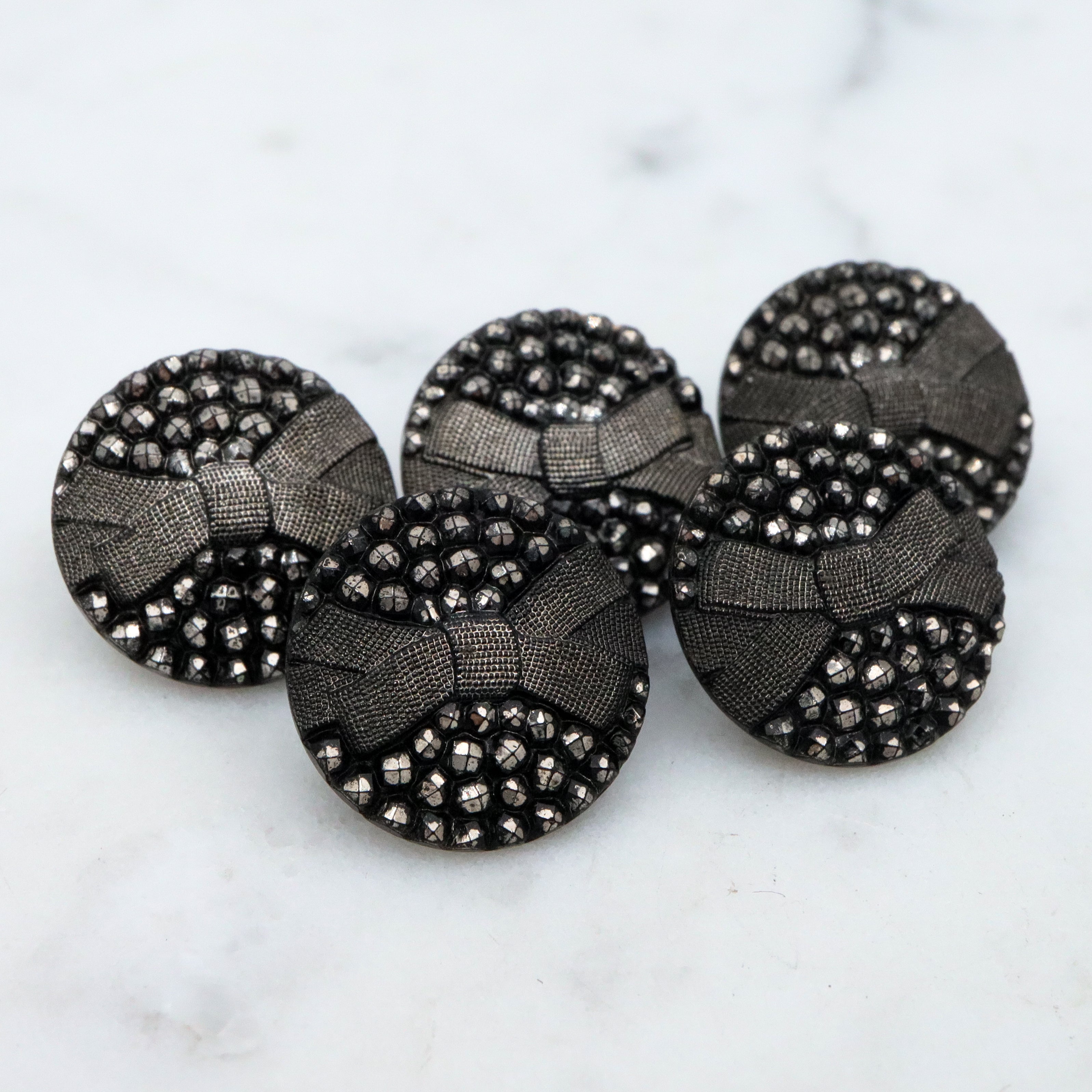 Set of 5 Antique Victorian jet black glass buttons w/silver painted rivets & bow
