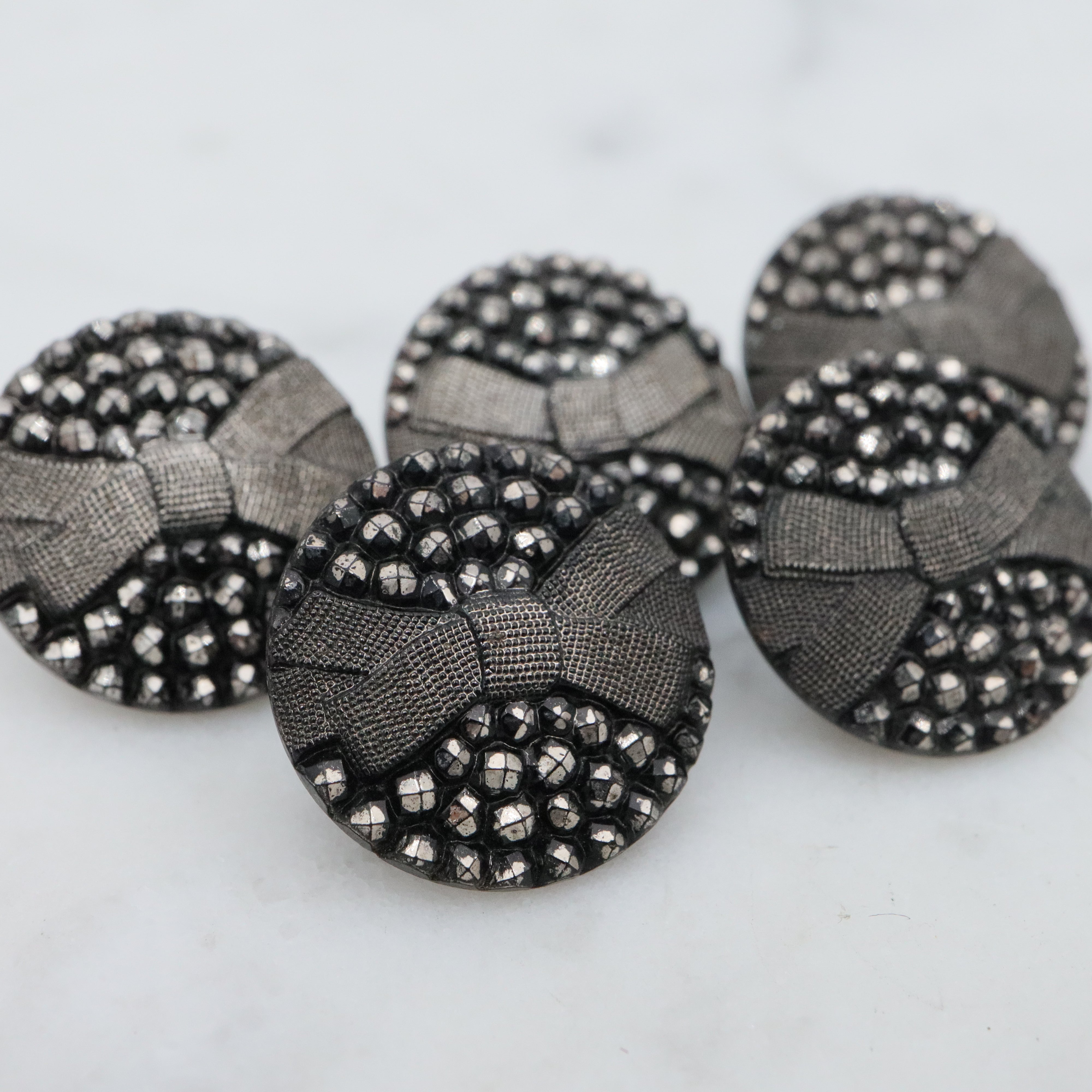 Set of 5 Antique Victorian jet black glass buttons w/silver painted rivets & bow