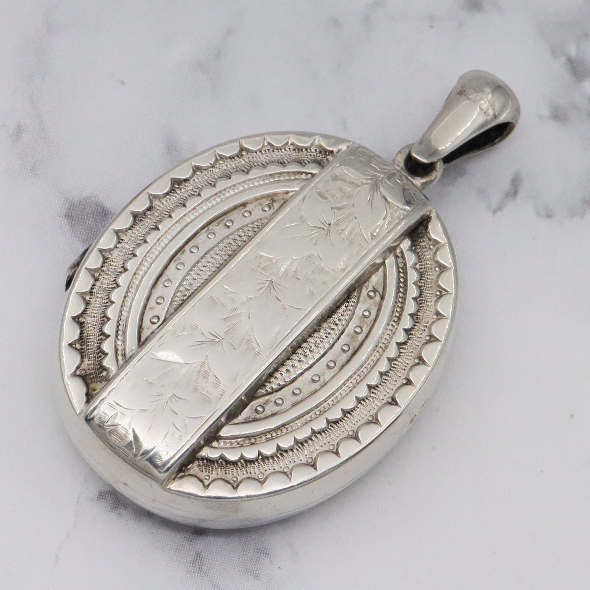 Antique Victorian engraved sterling locket
