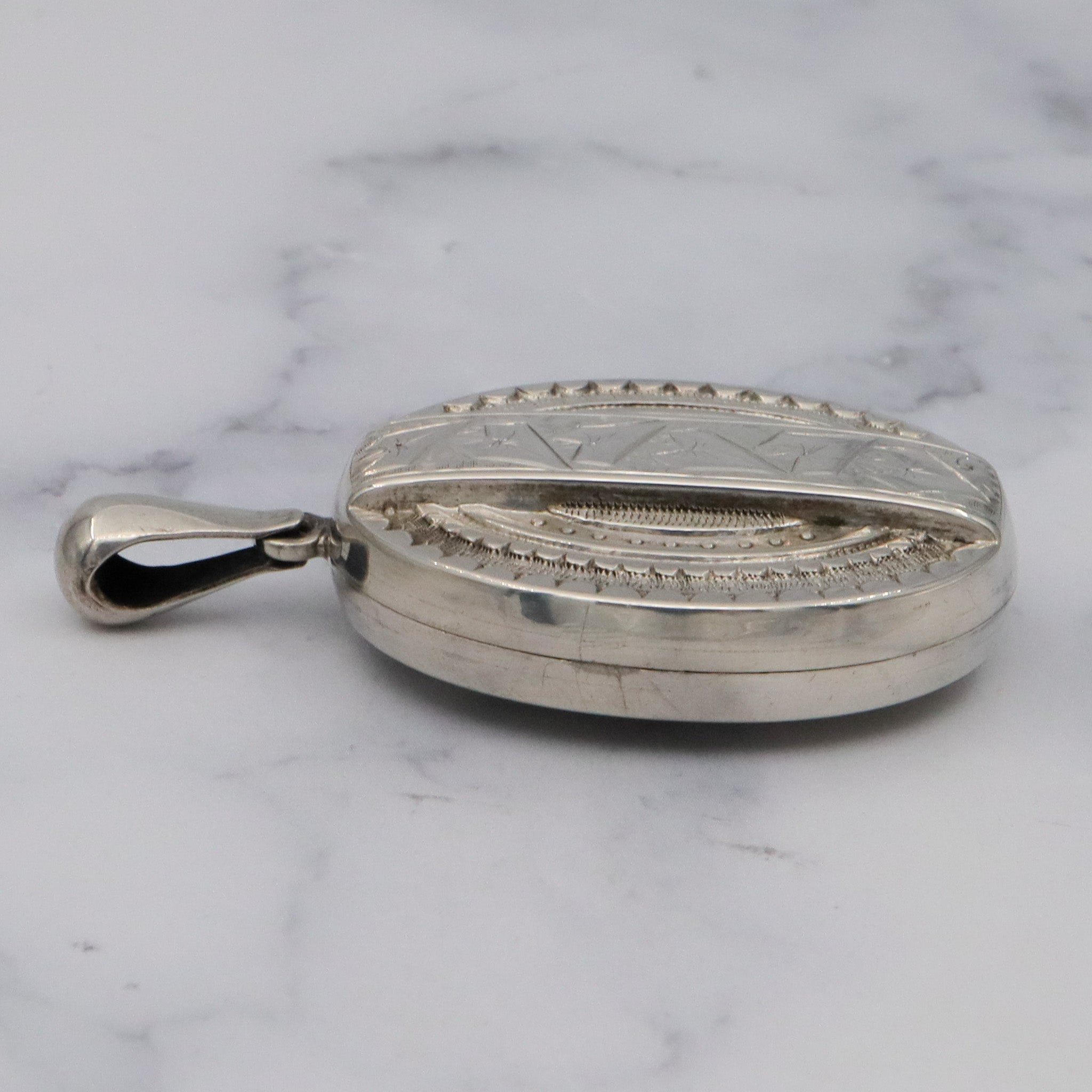 Antique Victorian engraved sterling locket