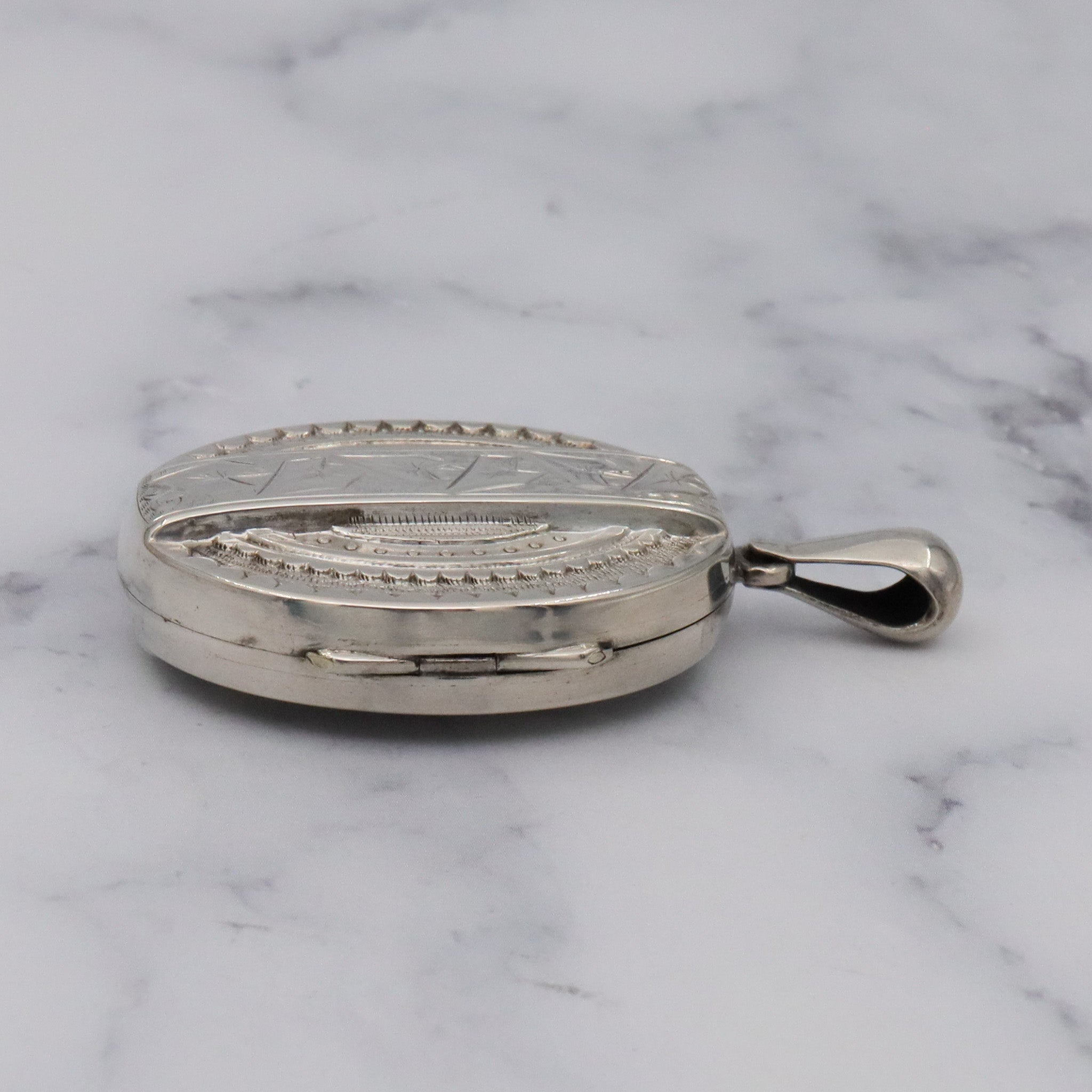 Antique Victorian engraved sterling locket