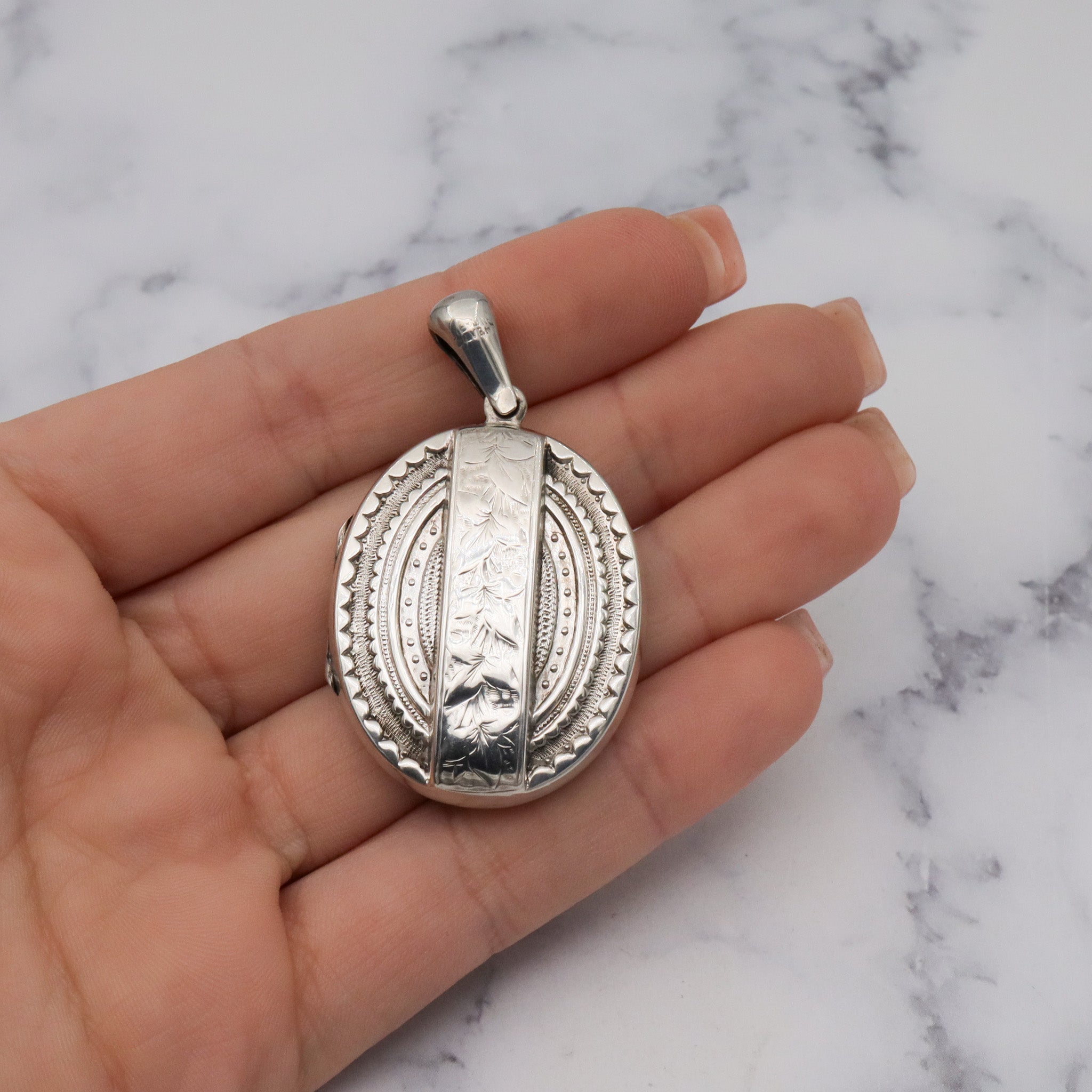 Antique Victorian engraved sterling locket