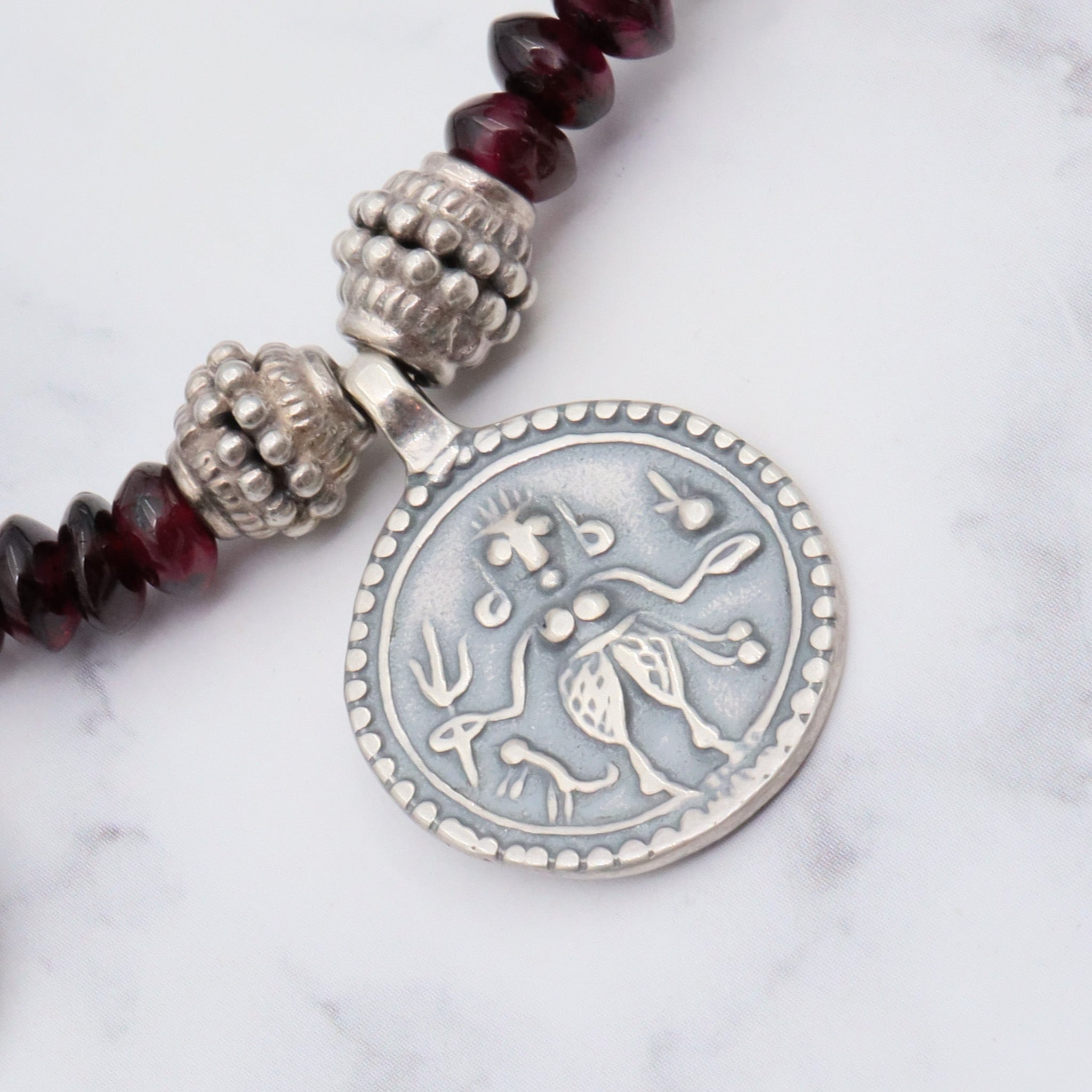 Vintage sterling garnet tribal necklace, 18"