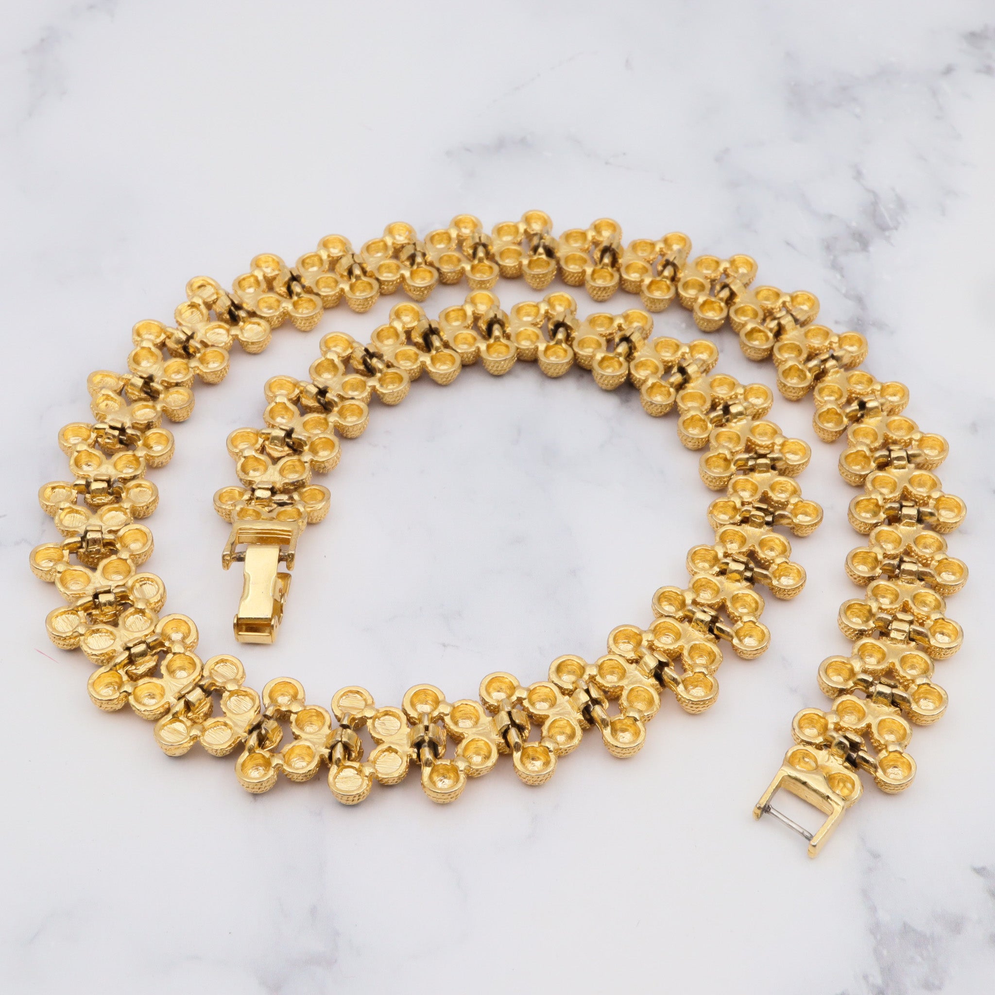 Vintage gold plated textured attached bead necklace with black glass tips