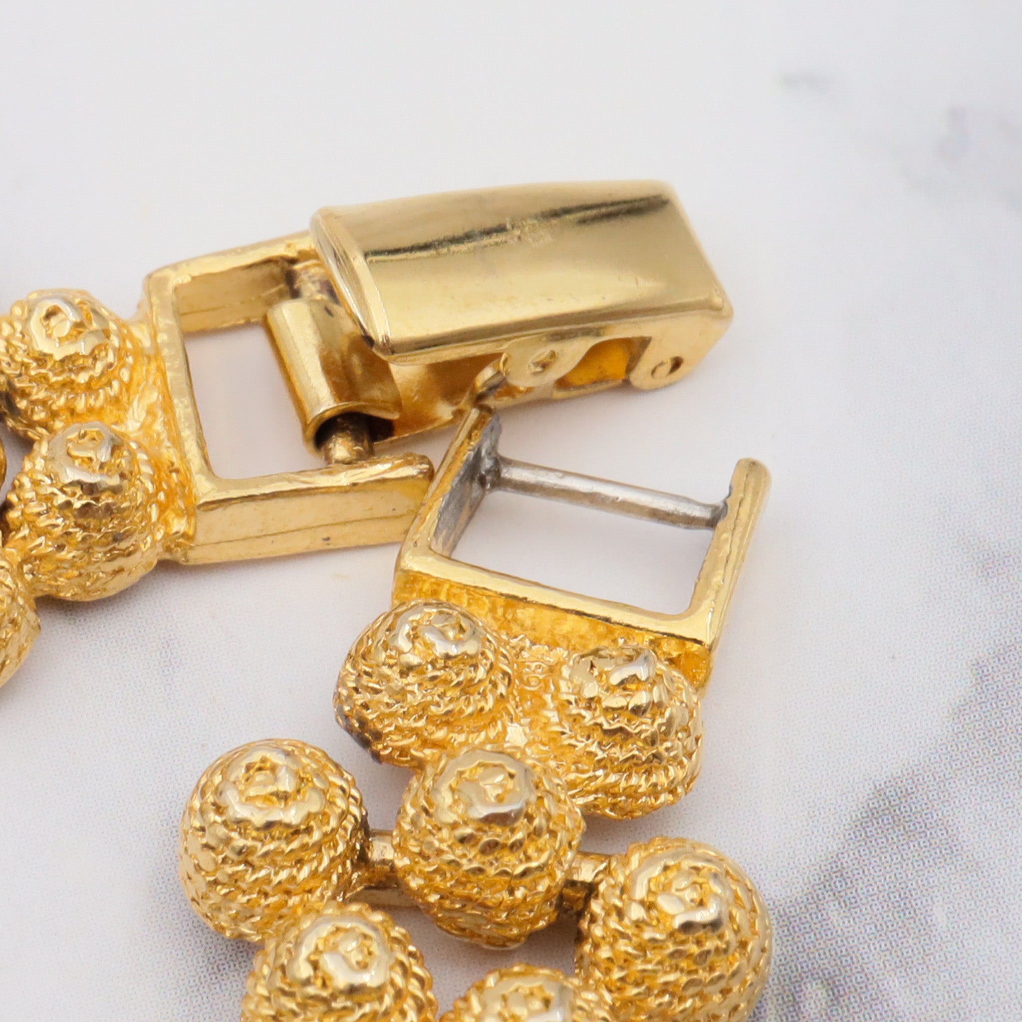 Vintage gold plated textured attached bead necklace with black glass tips