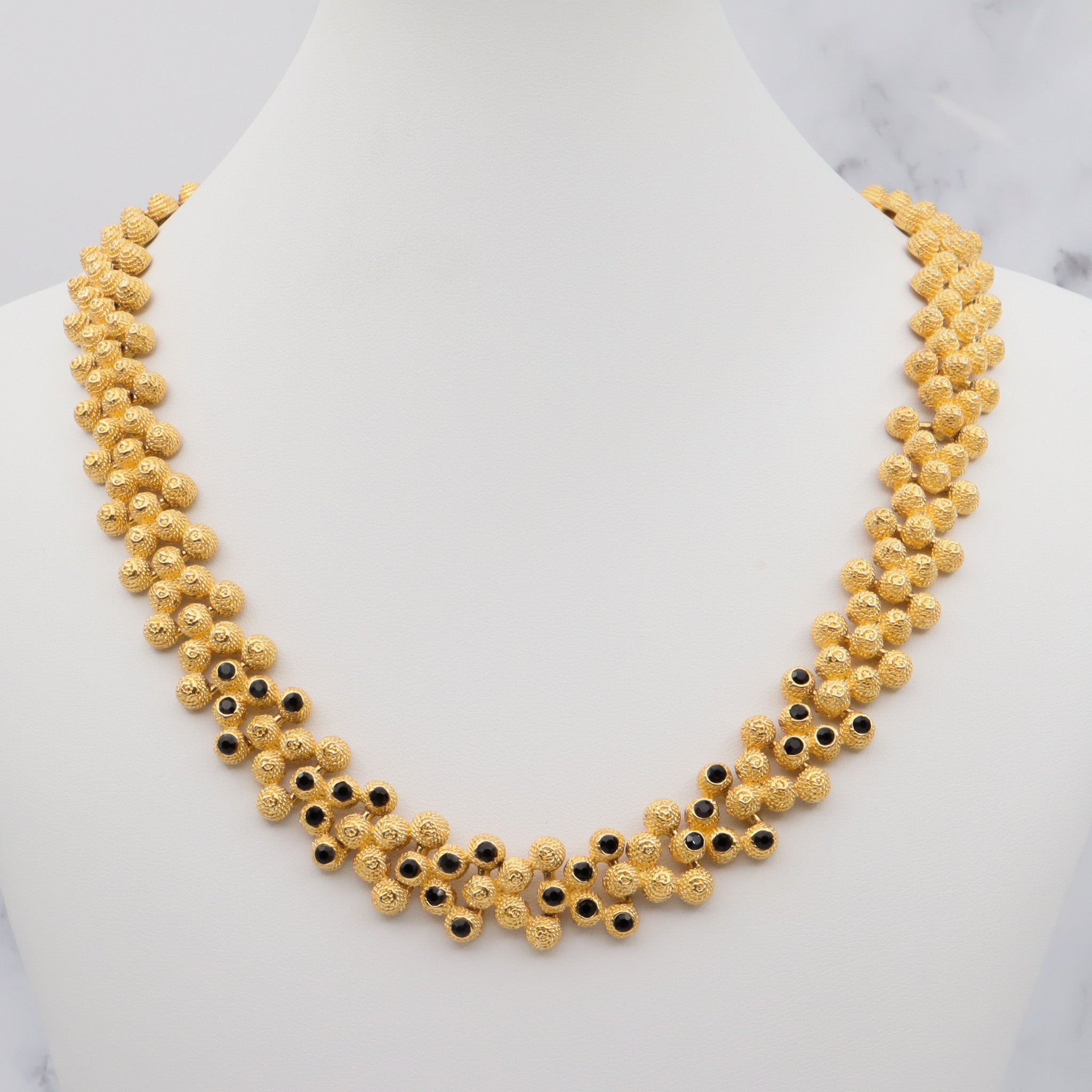 Vintage gold plated textured attached bead necklace with black glass tips