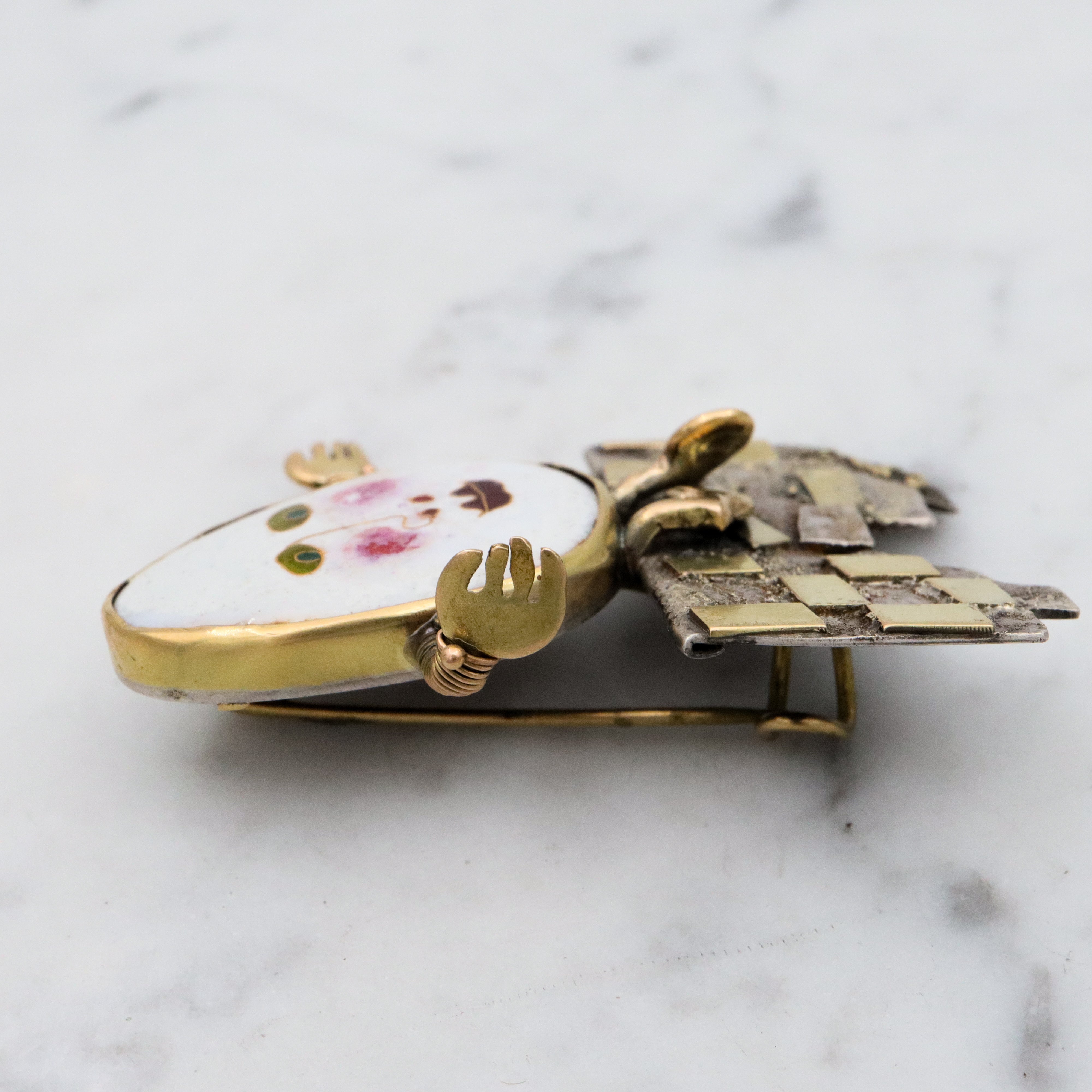 Incredible Avant-garde gold plated sterling & ceramic egg face sitting on wall brooch