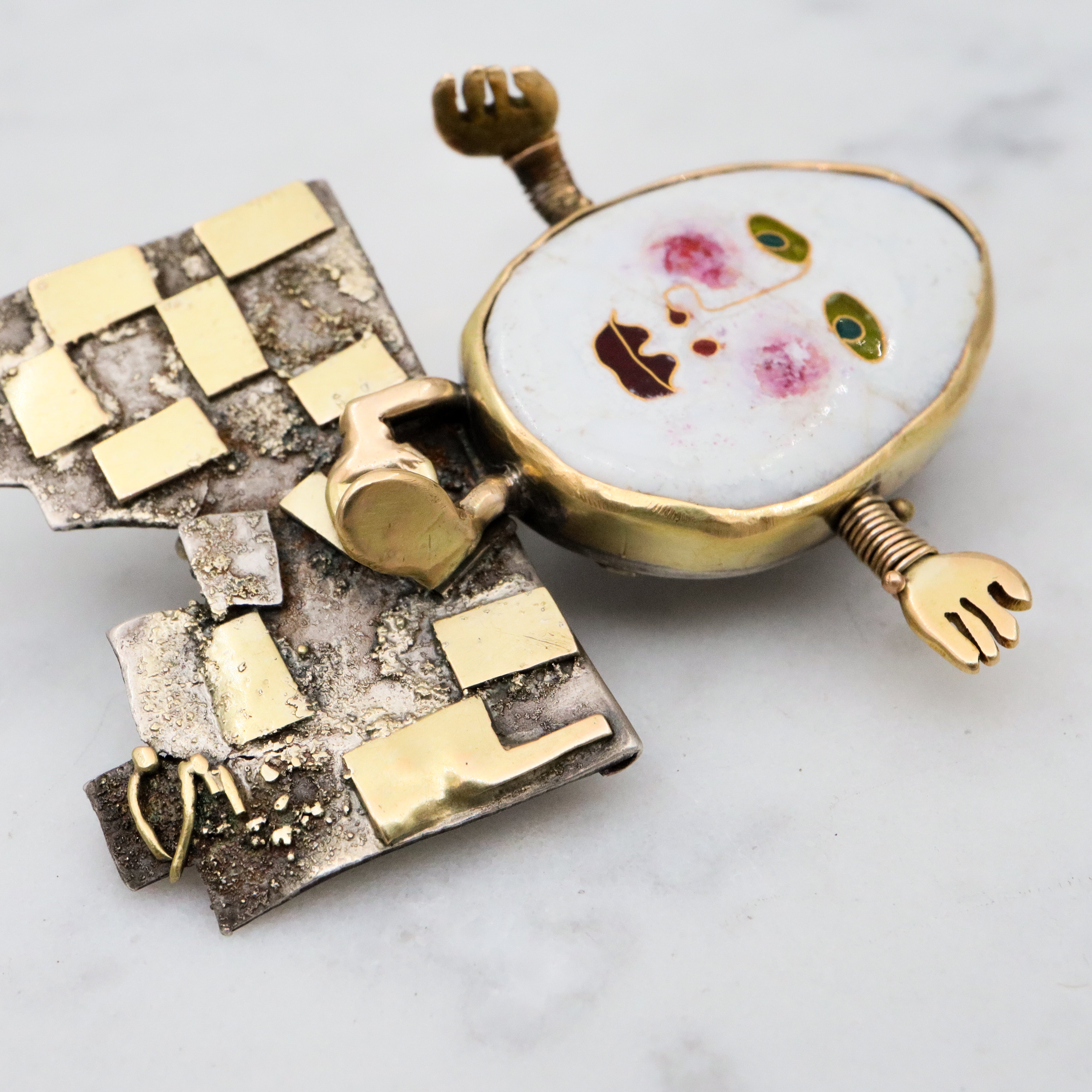 Incredible Avant-garde gold plated sterling & ceramic egg face sitting on wall brooch