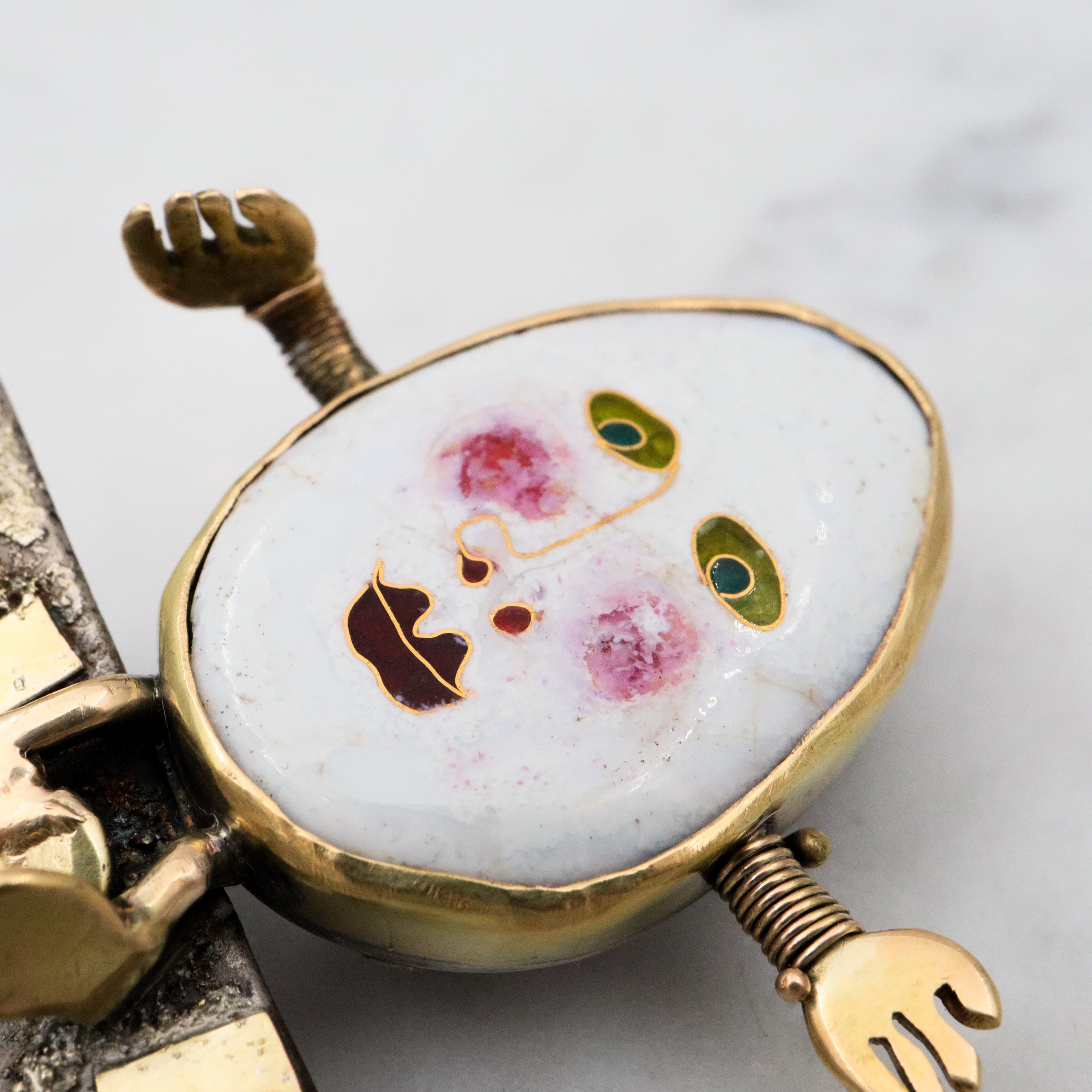 Incredible Avant-garde gold plated sterling & ceramic egg face sitting on wall brooch