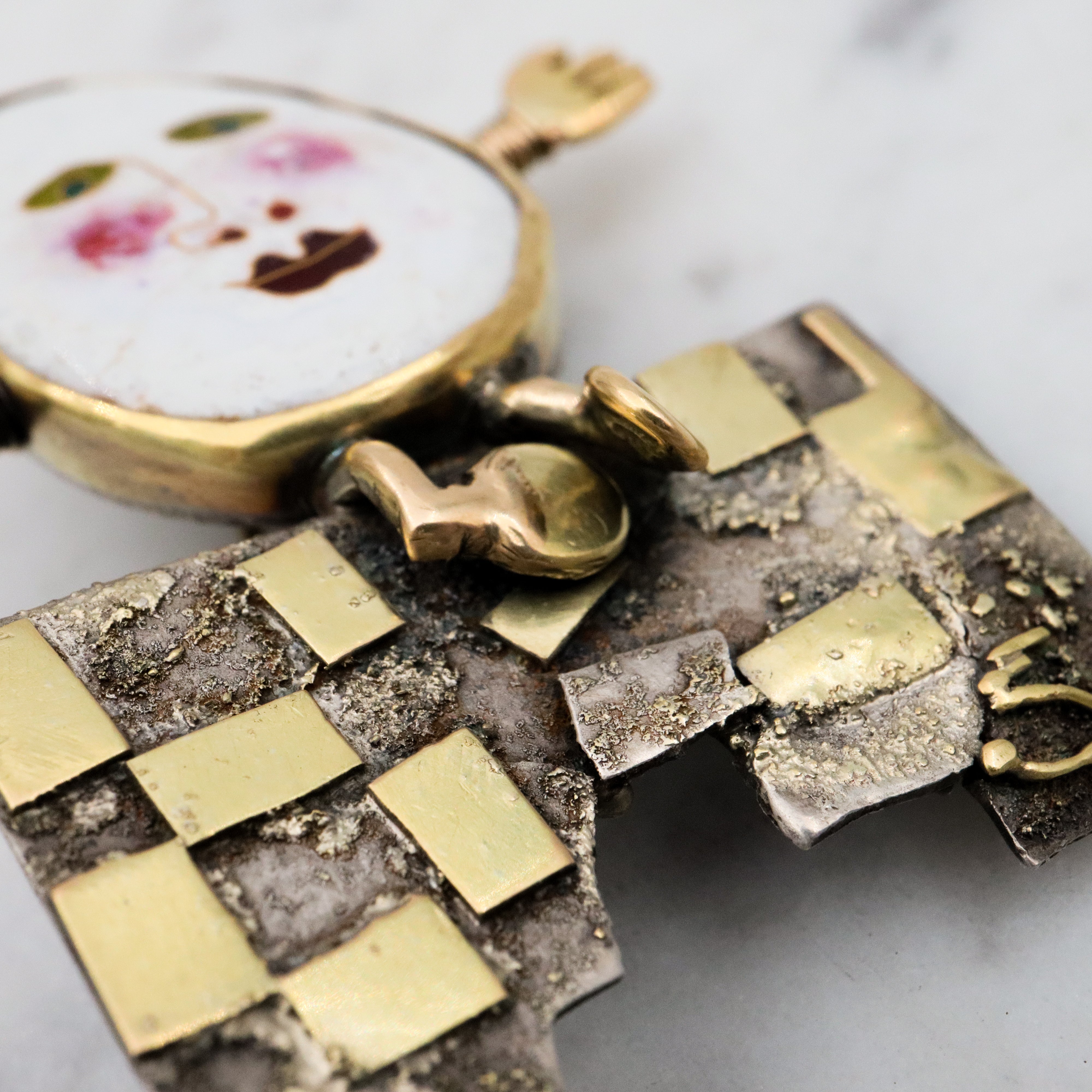 Incredible Avant-garde gold plated sterling & ceramic egg face sitting on wall brooch