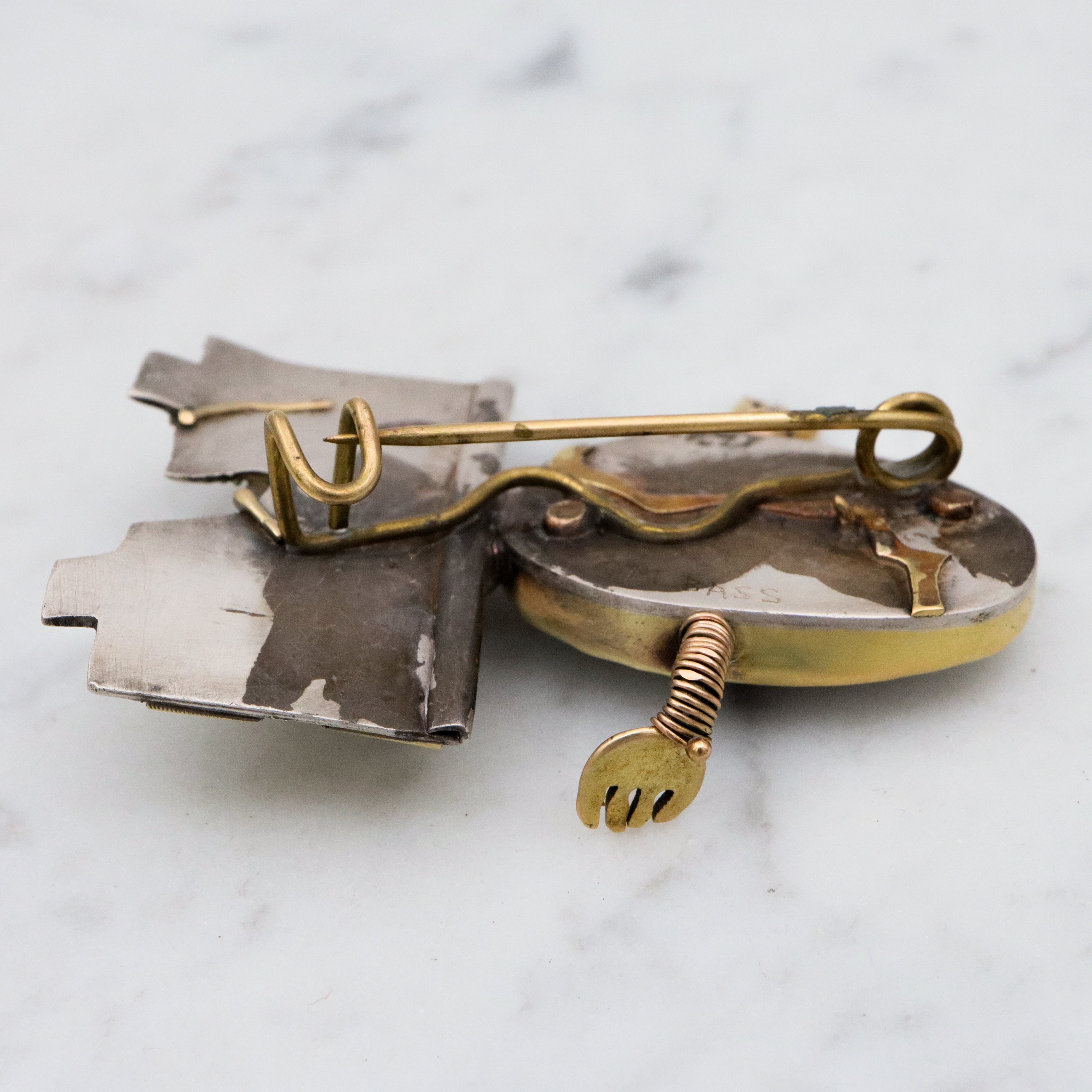Incredible Avant-garde gold plated sterling & ceramic egg face sitting on wall brooch