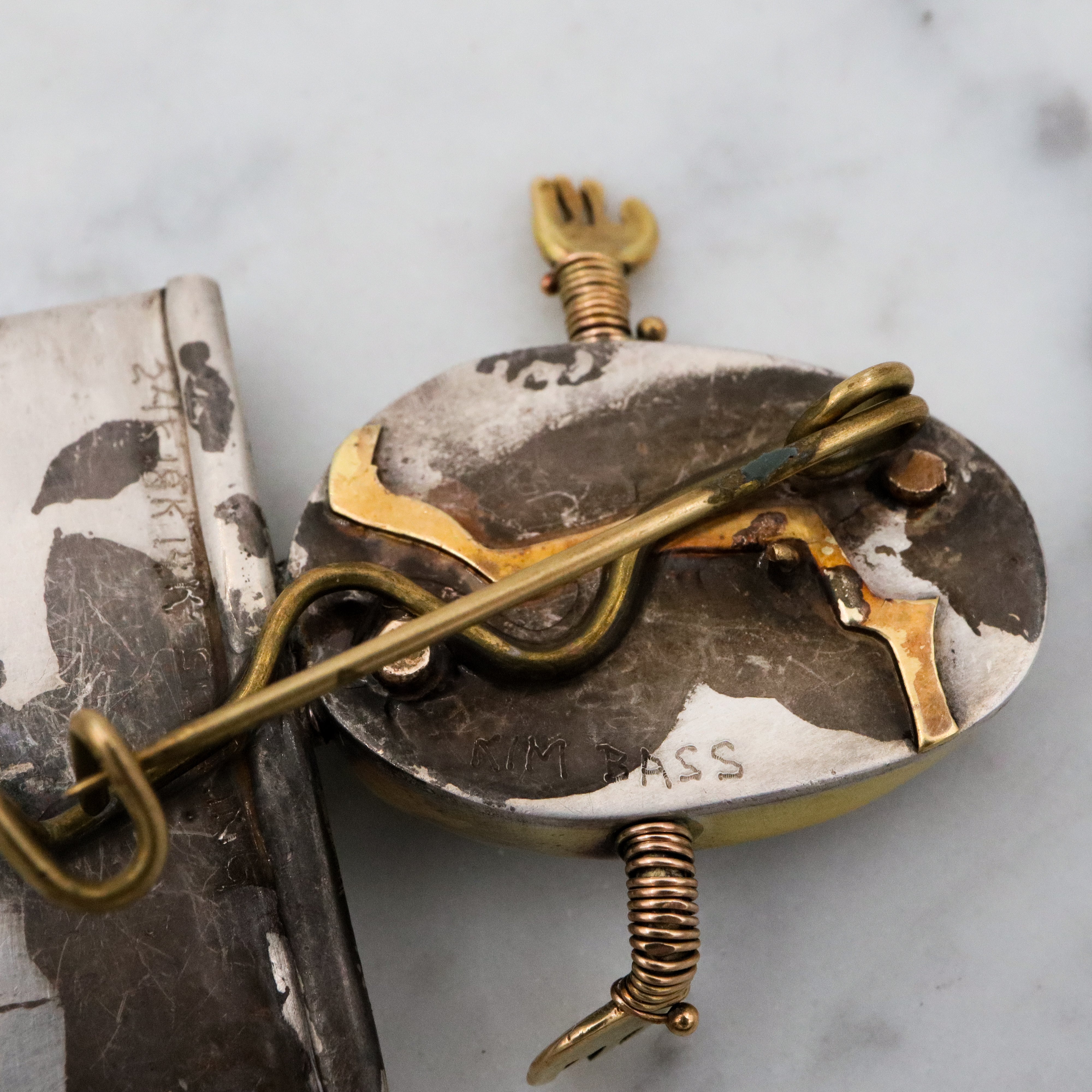 Incredible Avant-garde gold plated sterling & ceramic egg face sitting on wall brooch