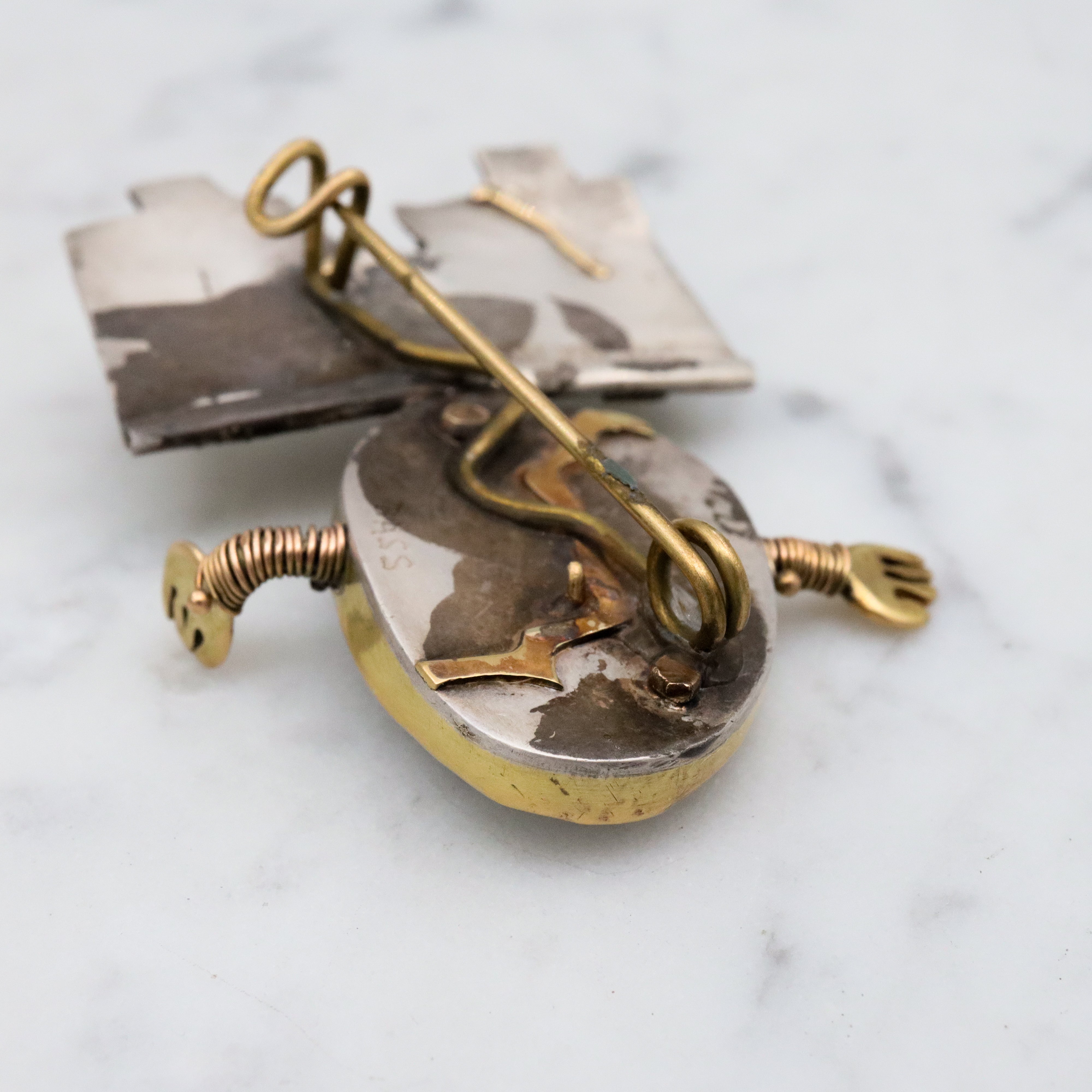 Incredible Avant-garde gold plated sterling & ceramic egg face sitting on wall brooch