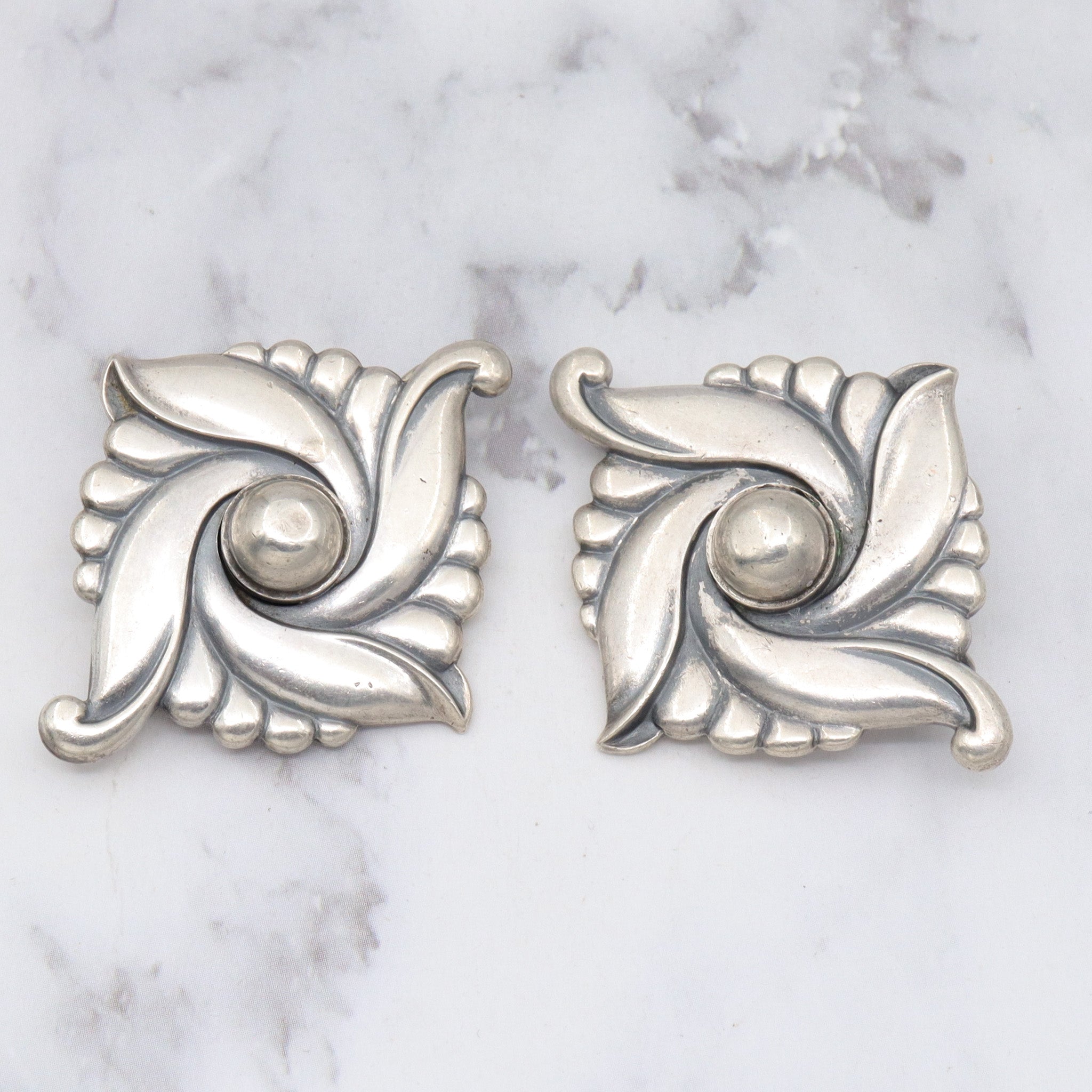 Pair of vintage Carl Ruopoli Mid-Century sterling swirl pins