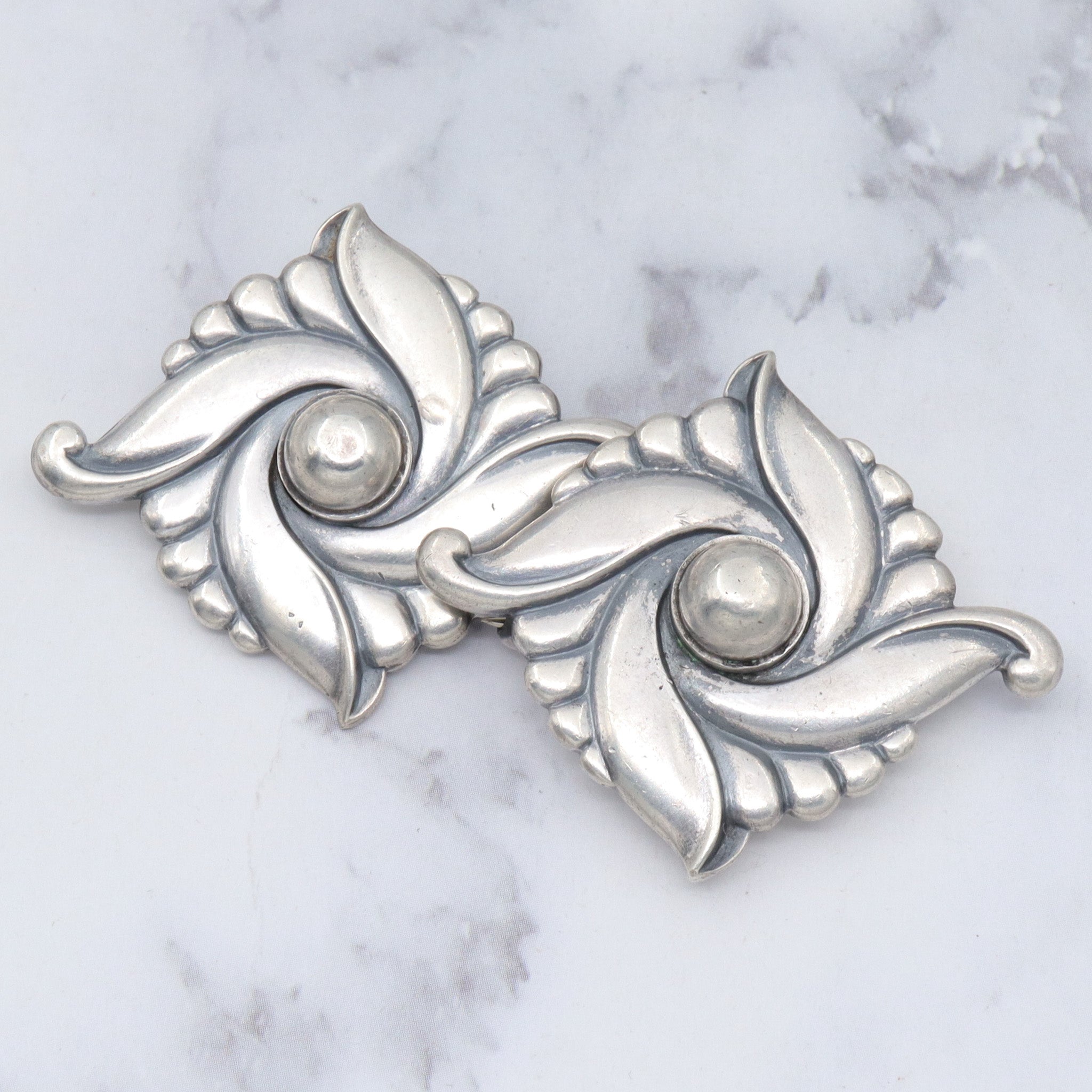 Pair of vintage Carl Ruopoli Mid-Century sterling swirl pins