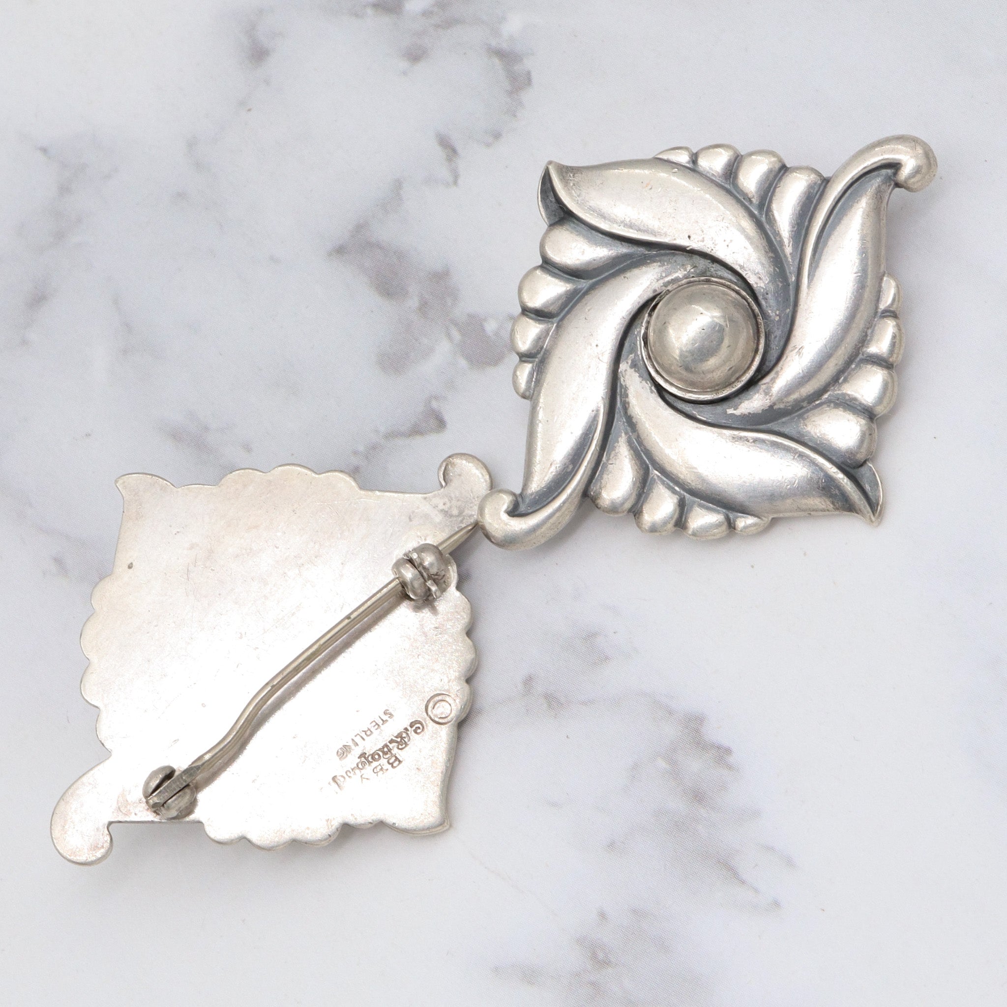 Pair of vintage Carl Ruopoli Mid-Century sterling swirl pins