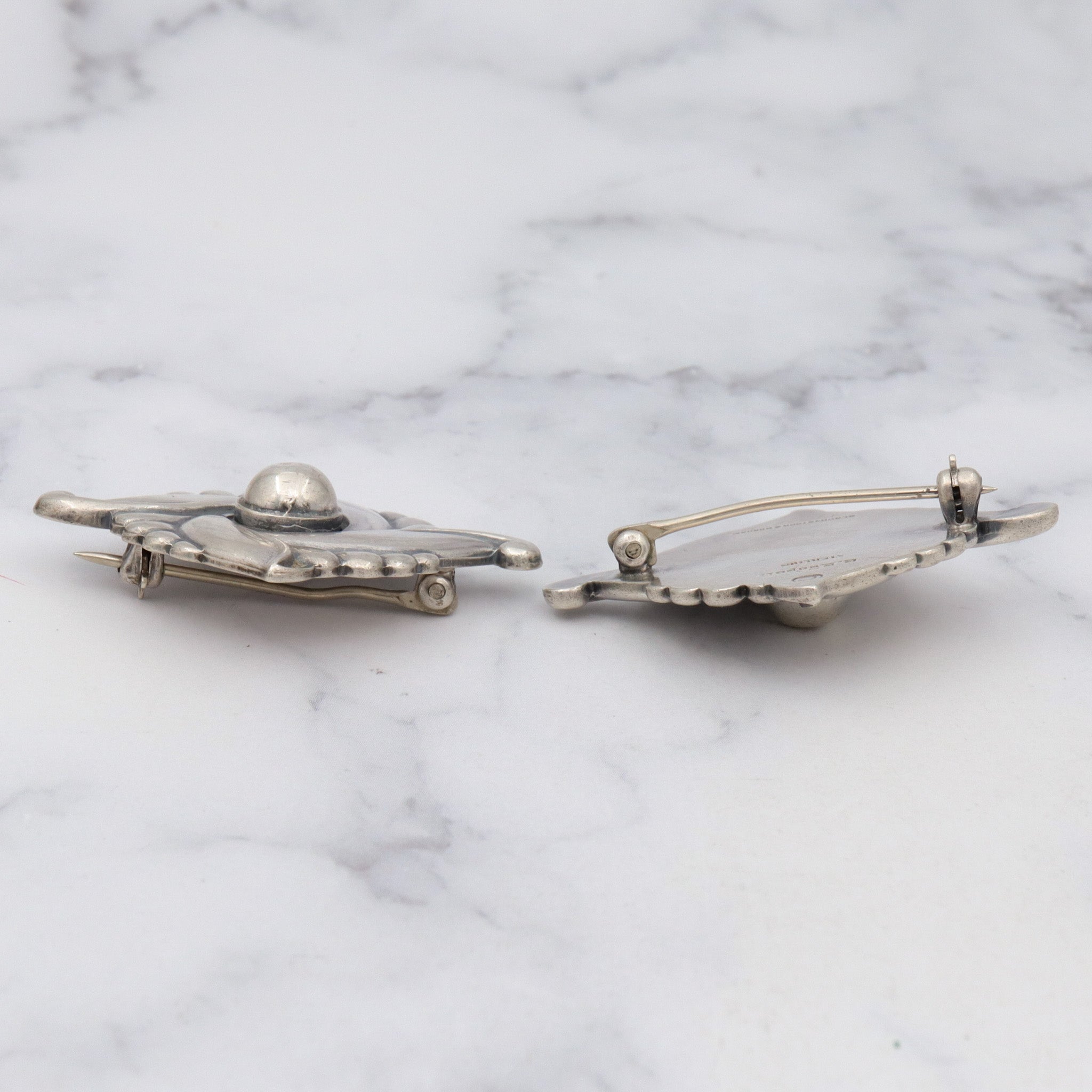 Pair of vintage Carl Ruopoli Mid-Century sterling swirl pins