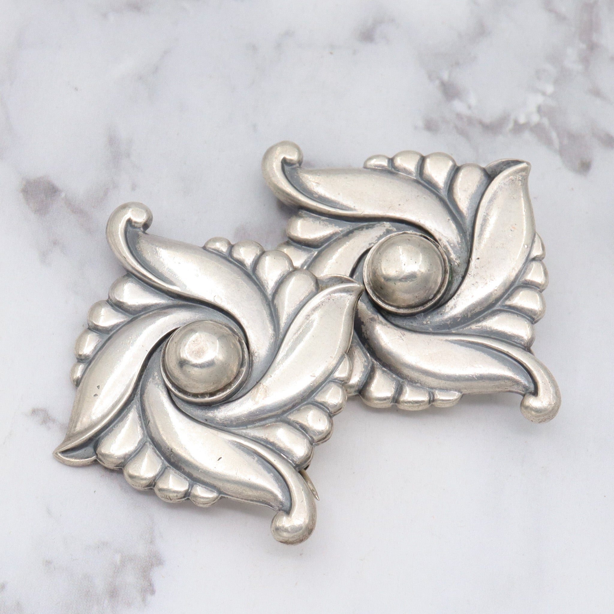 Pair of vintage Carl Ruopoli Mid-Century sterling swirl pins