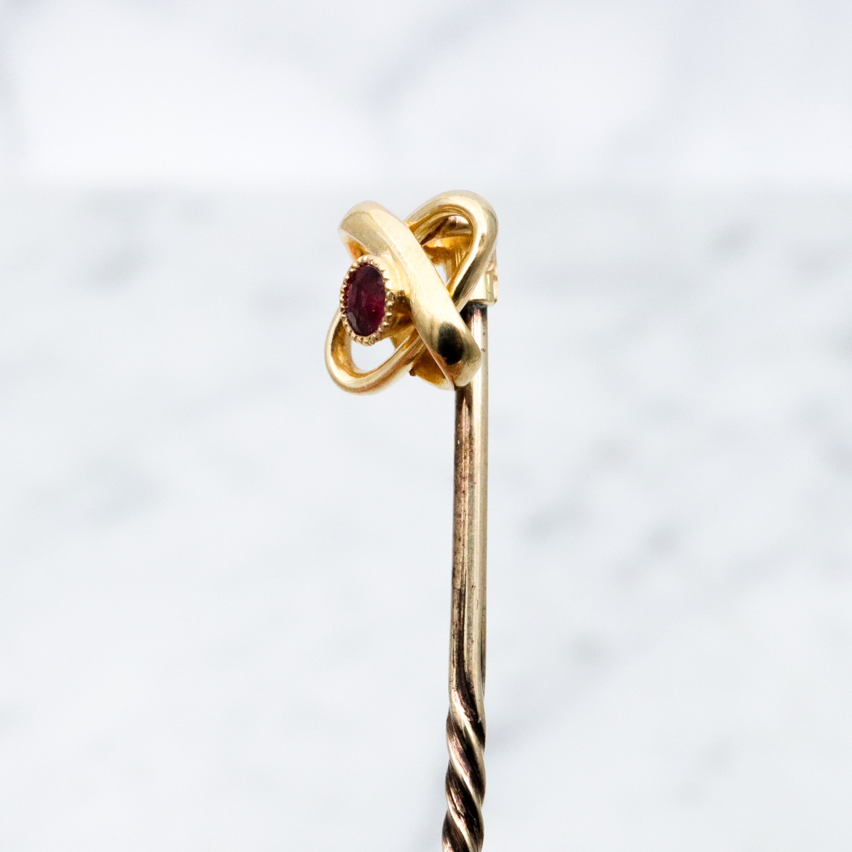 Antique Victorian 15k gold ruby infinity knot stick pin
