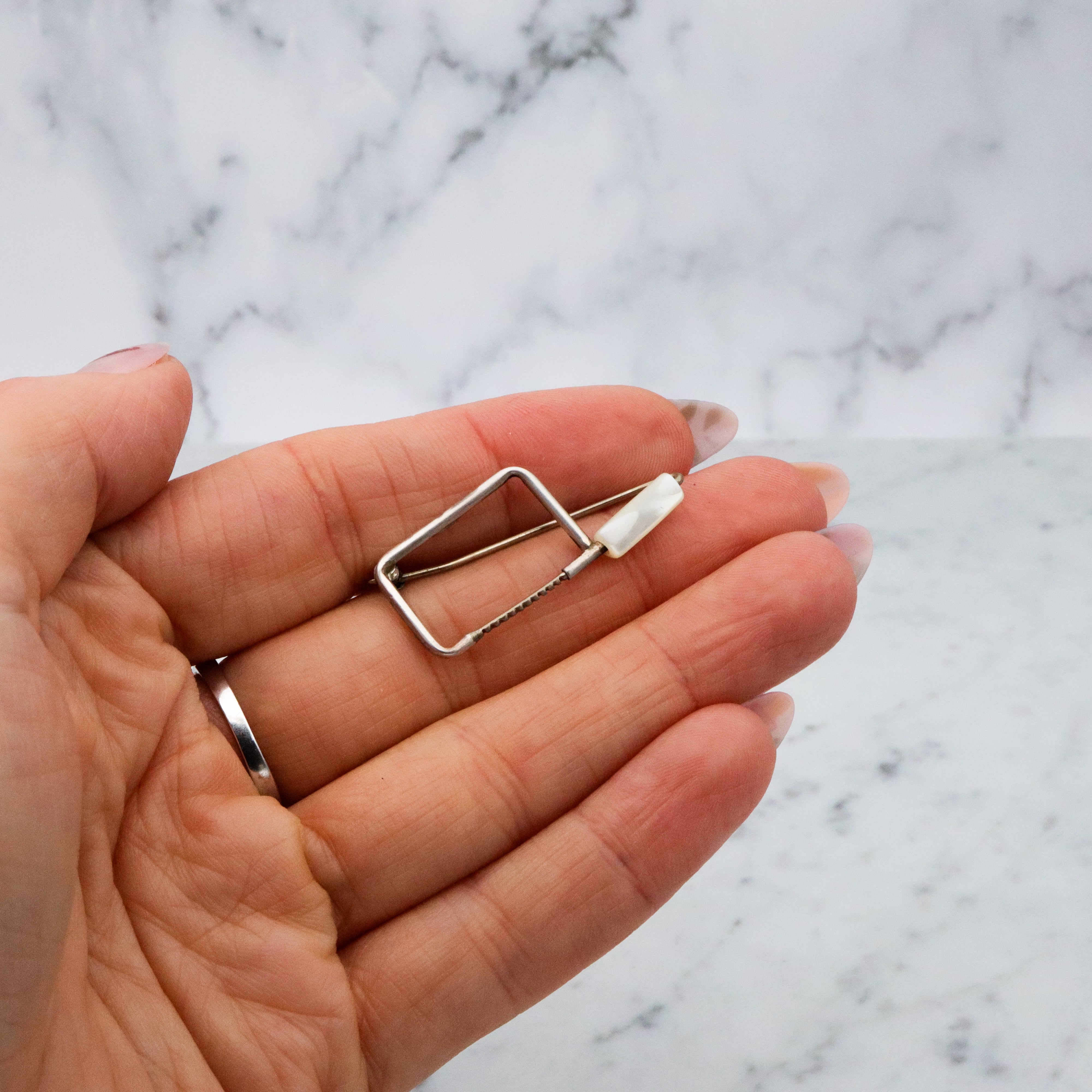 Unique one of a kind sterling & mother of pearl coping saw brooch