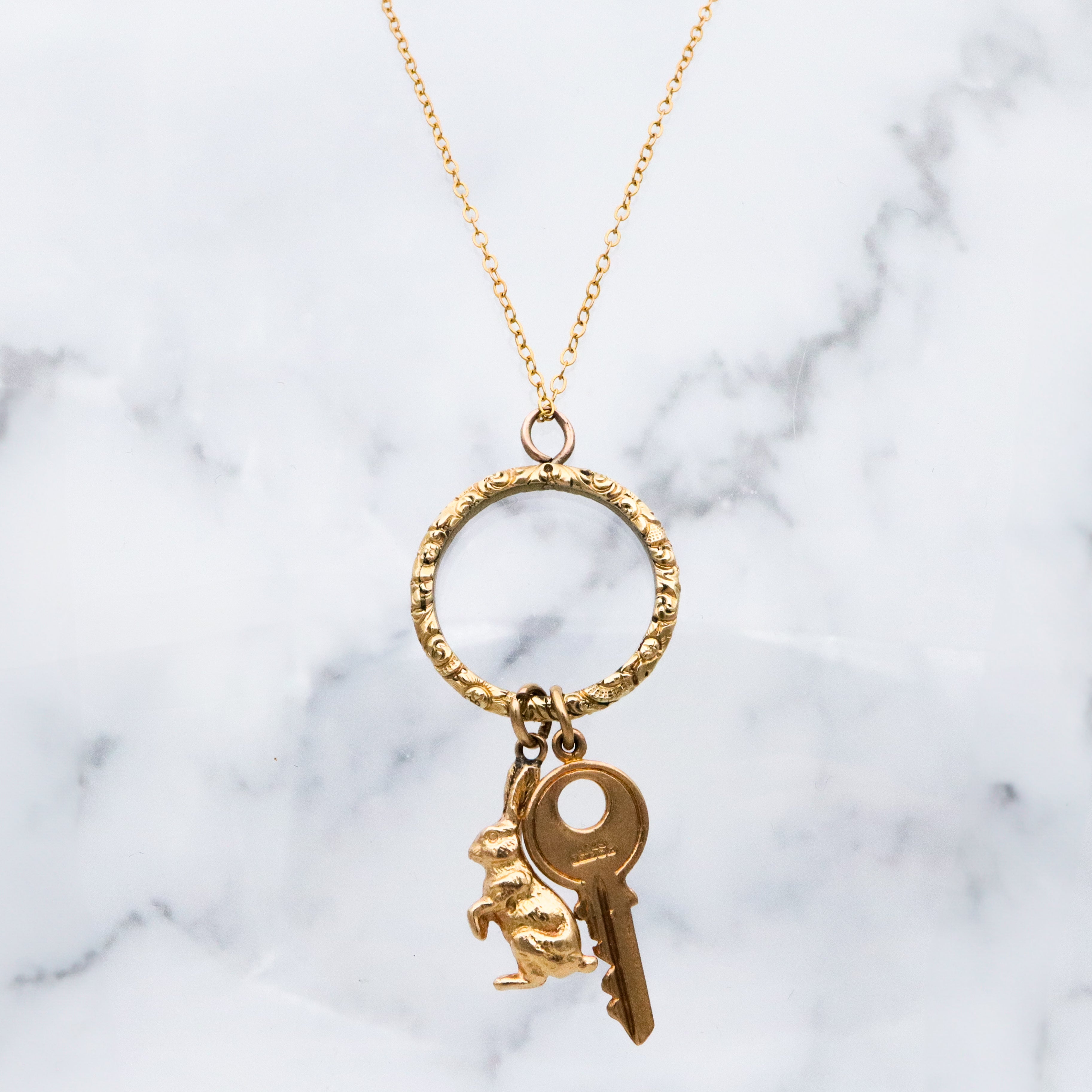 Antique Georgian rolled gold repousse split ring style charm holder pendant