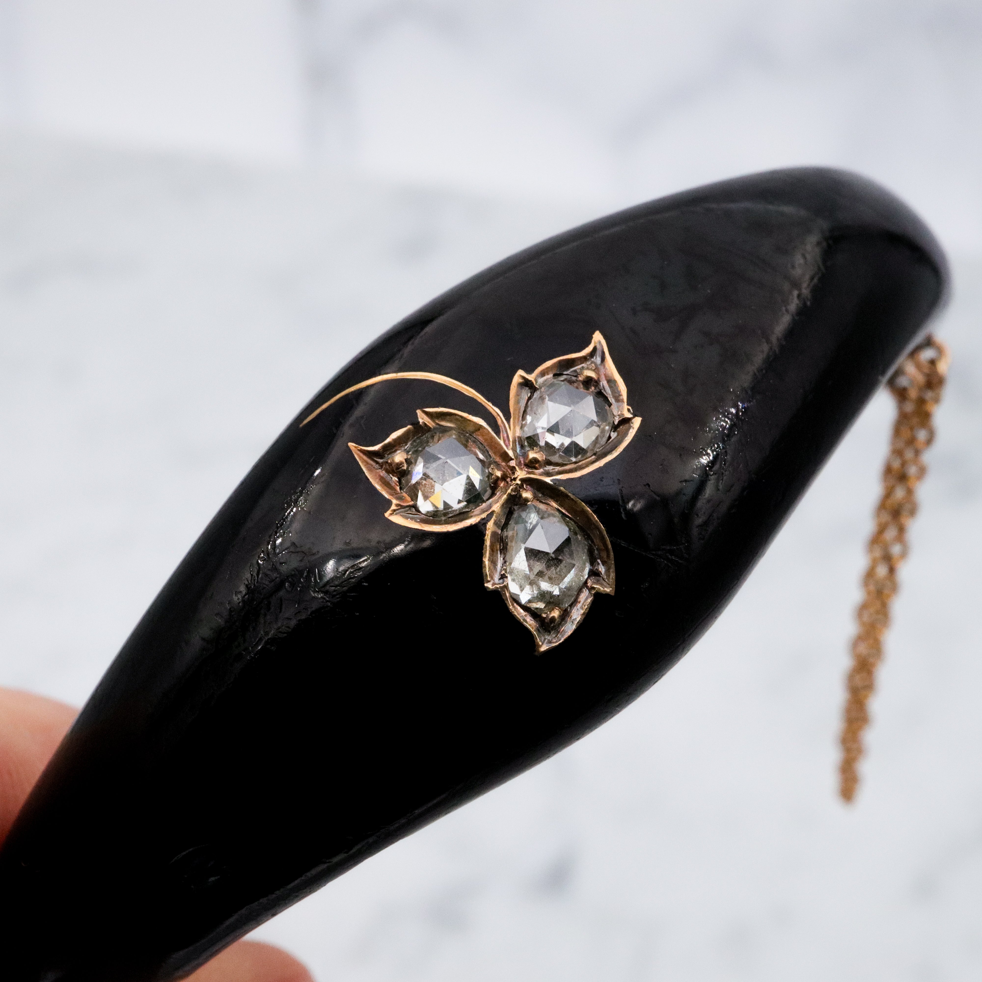 Antique Victorian 14k gold black enamel mourning bangle with rose cut diamonds